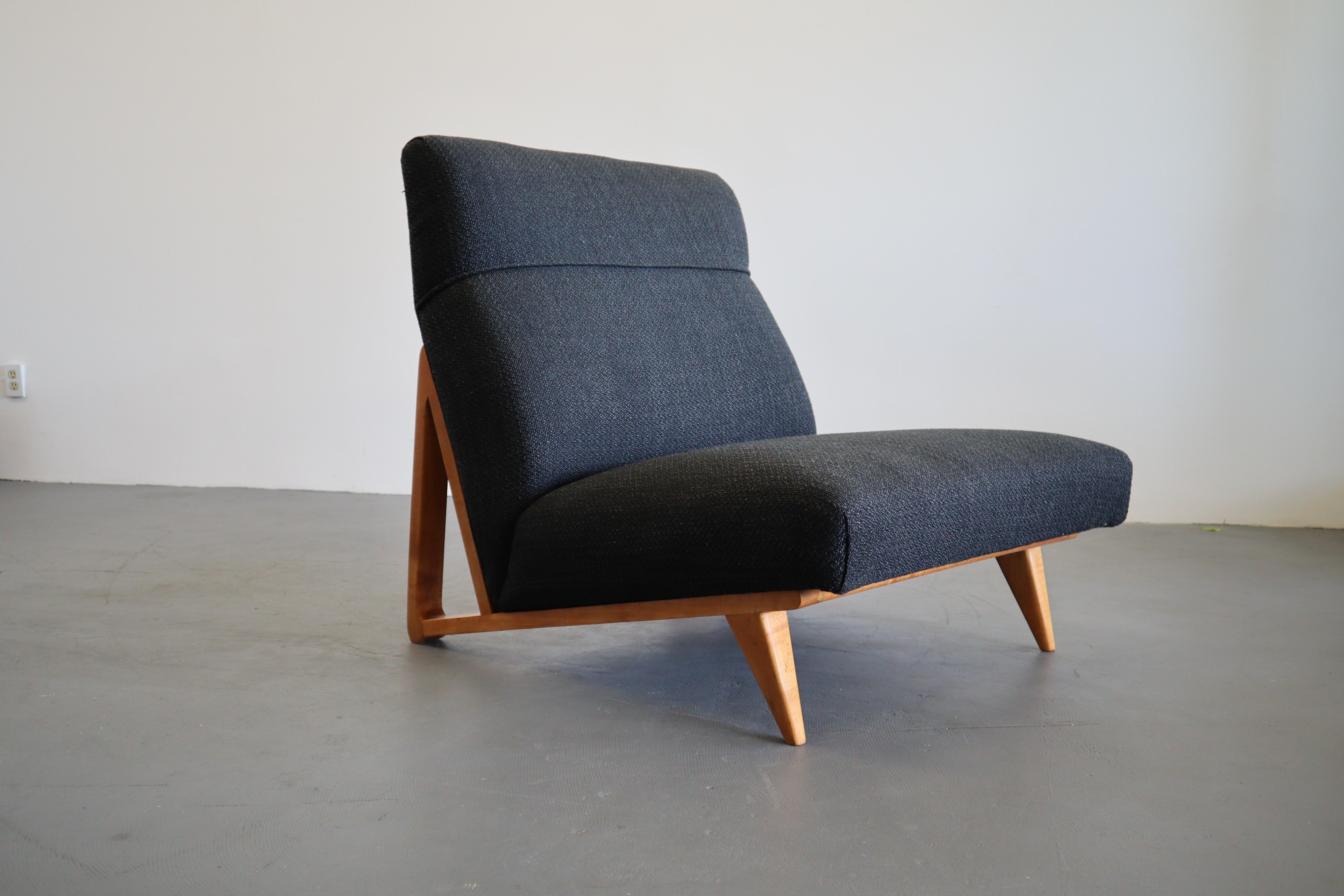 A very unique and possibly one off 1950s lounge chair in solid maple and new upholstery.  It is reminiscent of several great designs by Jens Risom, Edward Wormley and Hans Wegner.  It is very well constructed and sits wide and deep for a low lounge