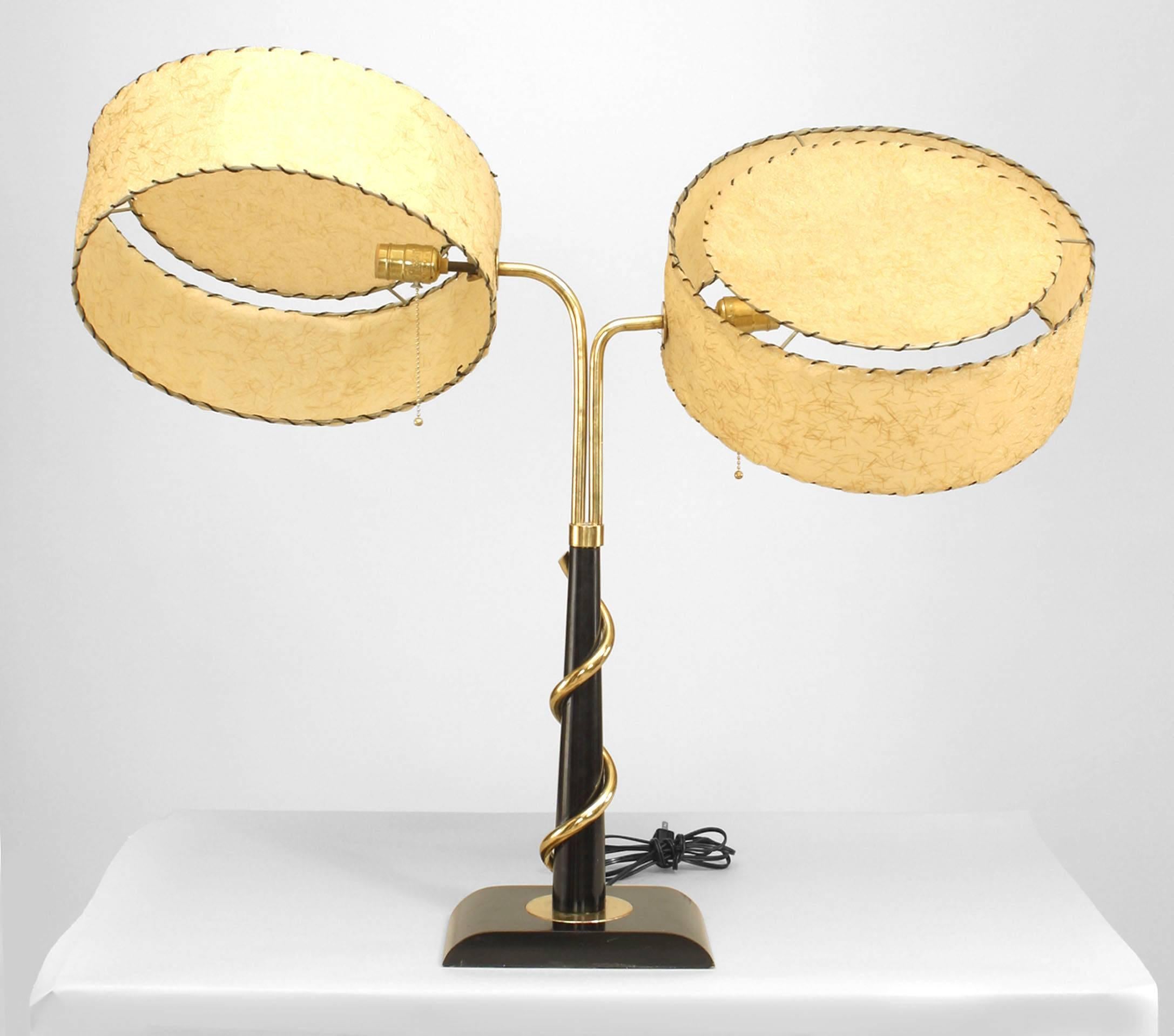 American Post-War Design 1950/60s ebonized and brass large student lamp with adjustable gold decorated drum shaped fiberglass faux parchment shades. (Attributed to MAJESTIC LAMP CO.)
