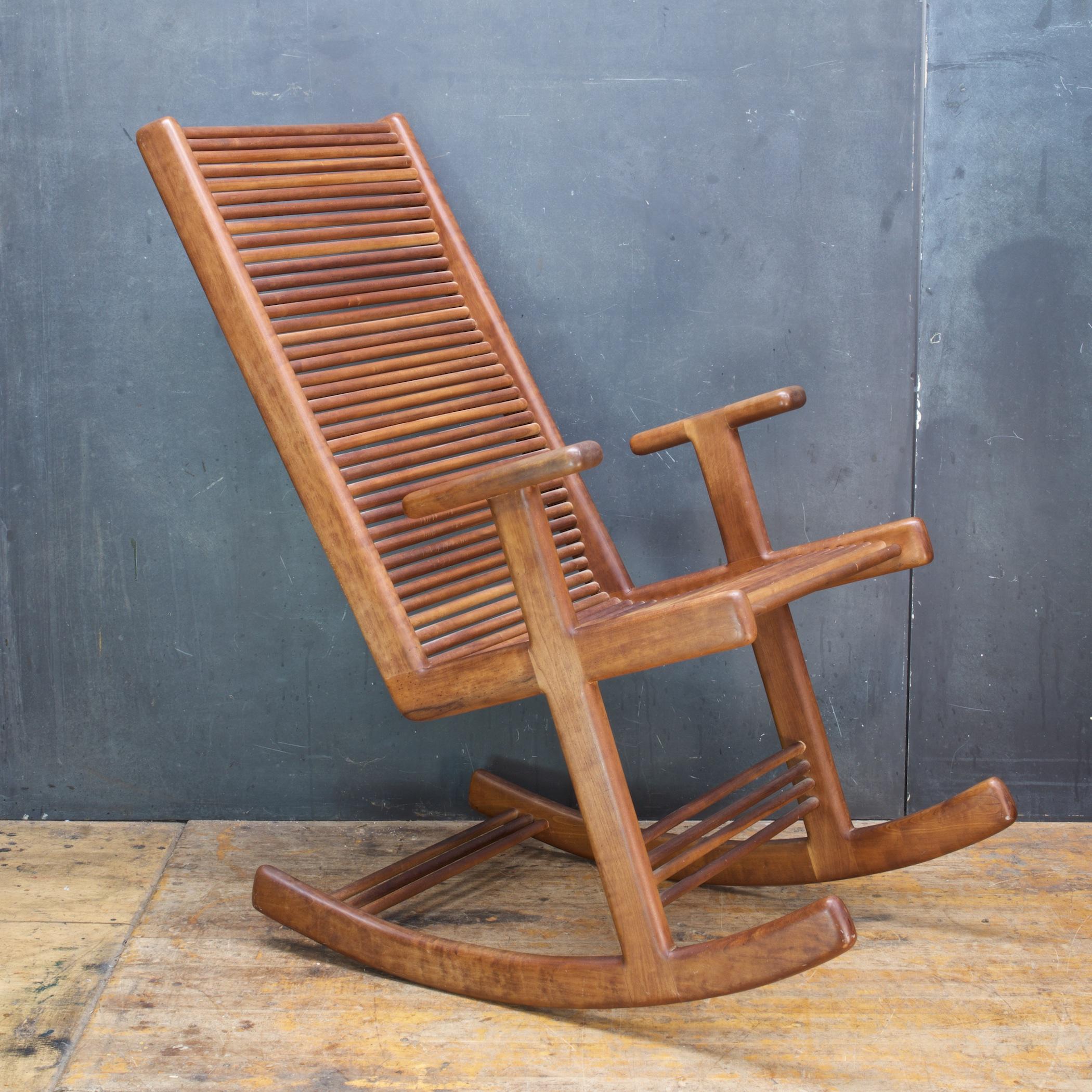 A sculptural and ergonomic dowel rocking chair & ottoman.  An 1980s Studio Craft set designed originally by Doug Lambrecht and Jerry Mandell.  A few years later Artist Stephen Hynson worked with a former employee of Lambrecht and Mandell to produced