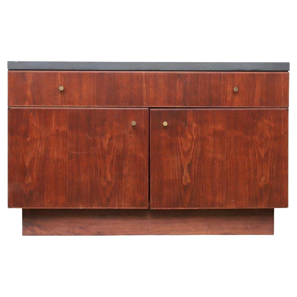 Mid century American Studio craft thick slate top black walnut credenza cabinet. beautiful hand crafted solid black walnut single drawer cabinet. Has 2 Lower doors with Brass Knobs lower area is wide open no shelves - great for storage. Has 1.25