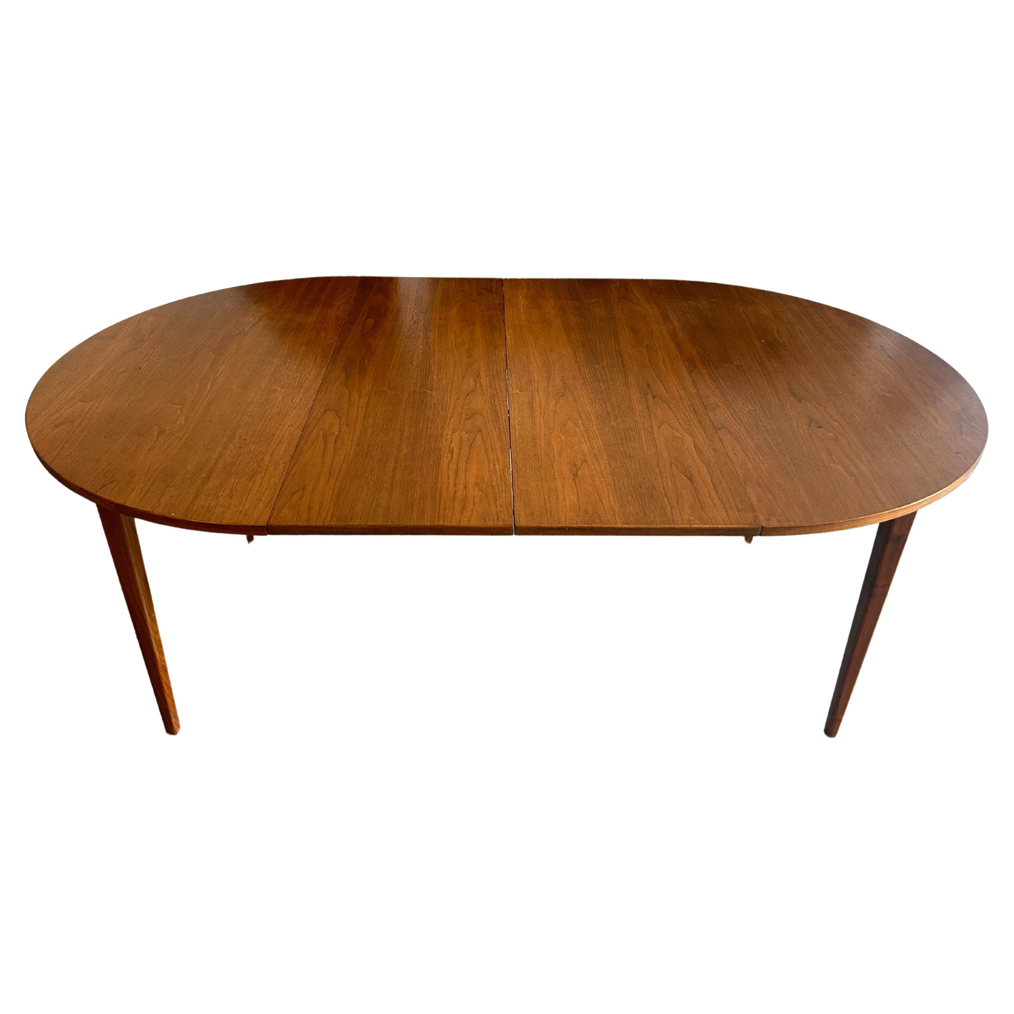 Mid century American walnut round dining table with 2 leaves  For Sale