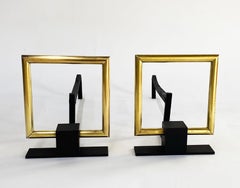 Mid-Century Andirons in Brass and Iron in the Style of Donald Deskey