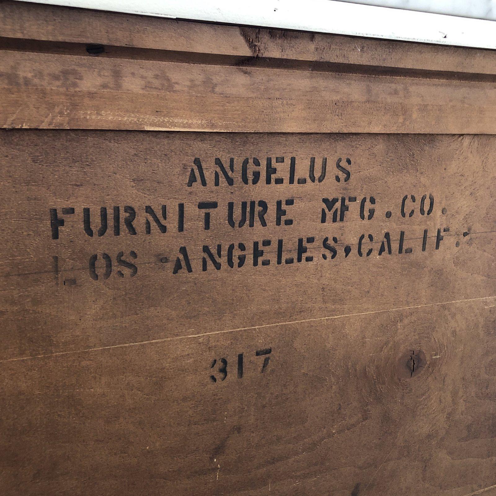 A midcentury sideboard by Angelus Furniture. A Los Angeles Company, crafted of solid woods. The outside finish has been updated with a white coat. The backing and inner cabinet are still in the original wood finish. The top has been updated with a