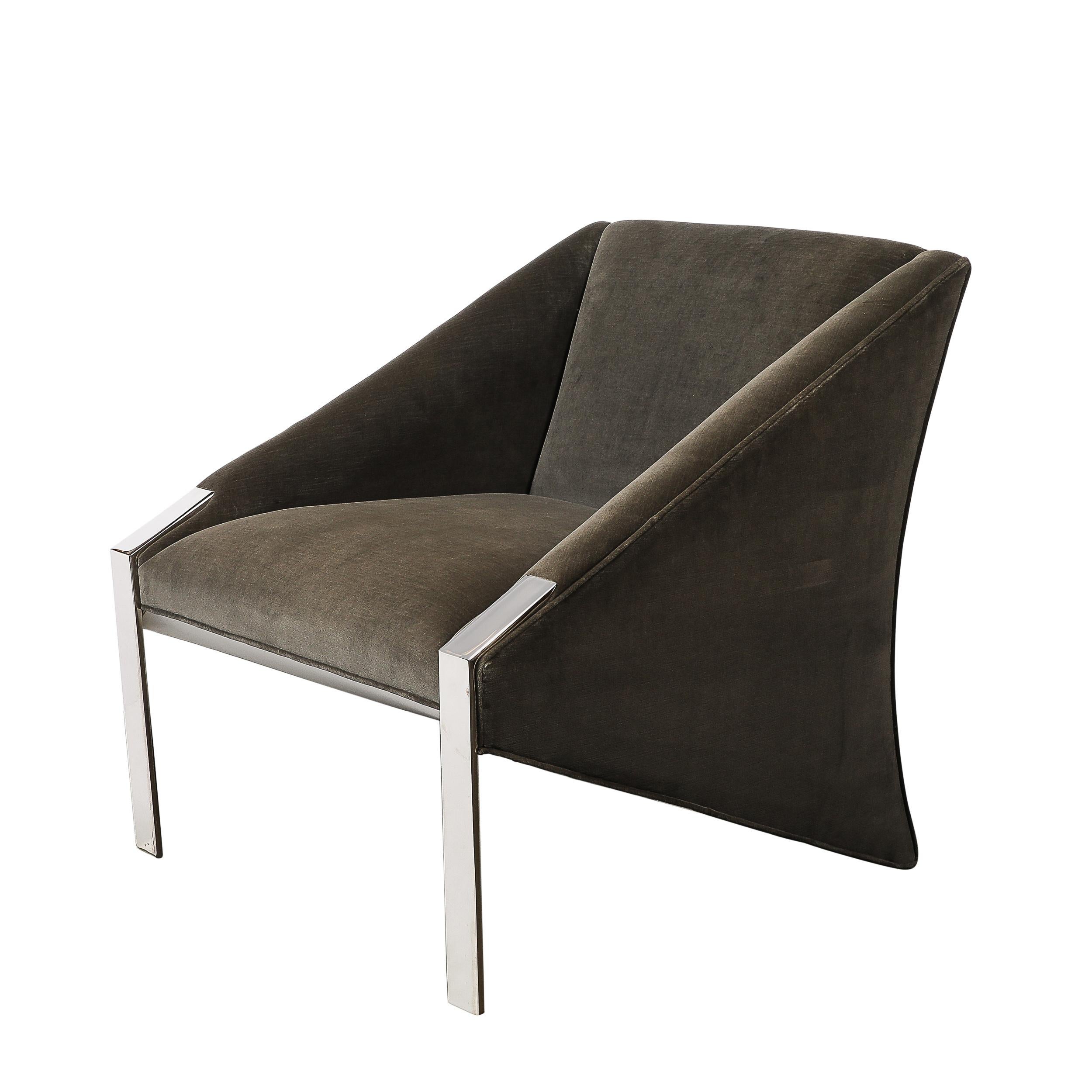 These Mid-Century Modernist angular club chairs, designed by the esteemed Andrée Putman in France, Circa 1970. They serve as a beautiful example of the the sophistication and innovative design elements of the period. Upholstered in luxurious smoked