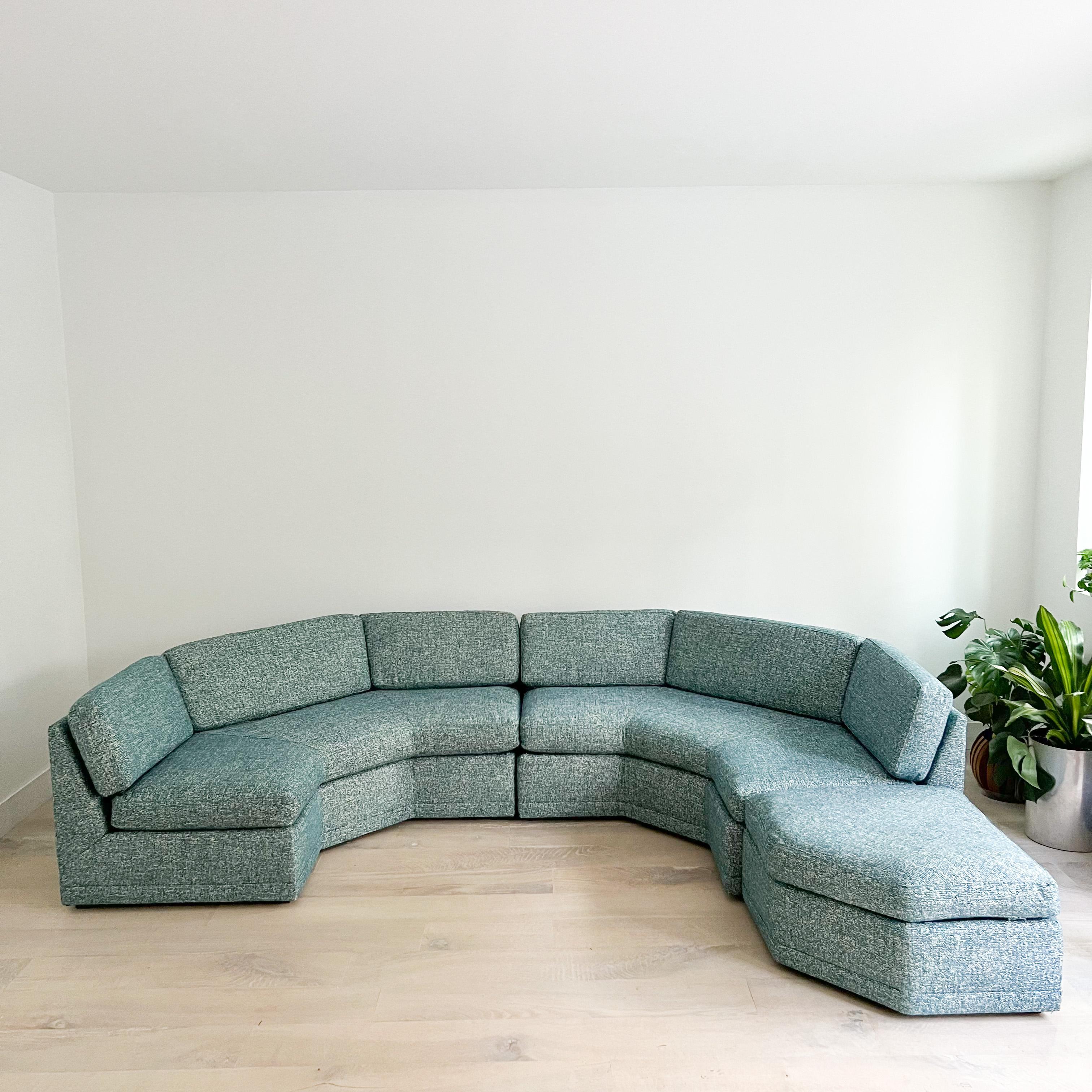 Stunning Mid-Century Modern angular sectional sofa with floating ottoman that can go against either side. New teal tweed upholstery. Great sofa for lounging!

Each 3 sided piece measures -
64” wide
32” high
64” deep
17.5”SH

Ottoman