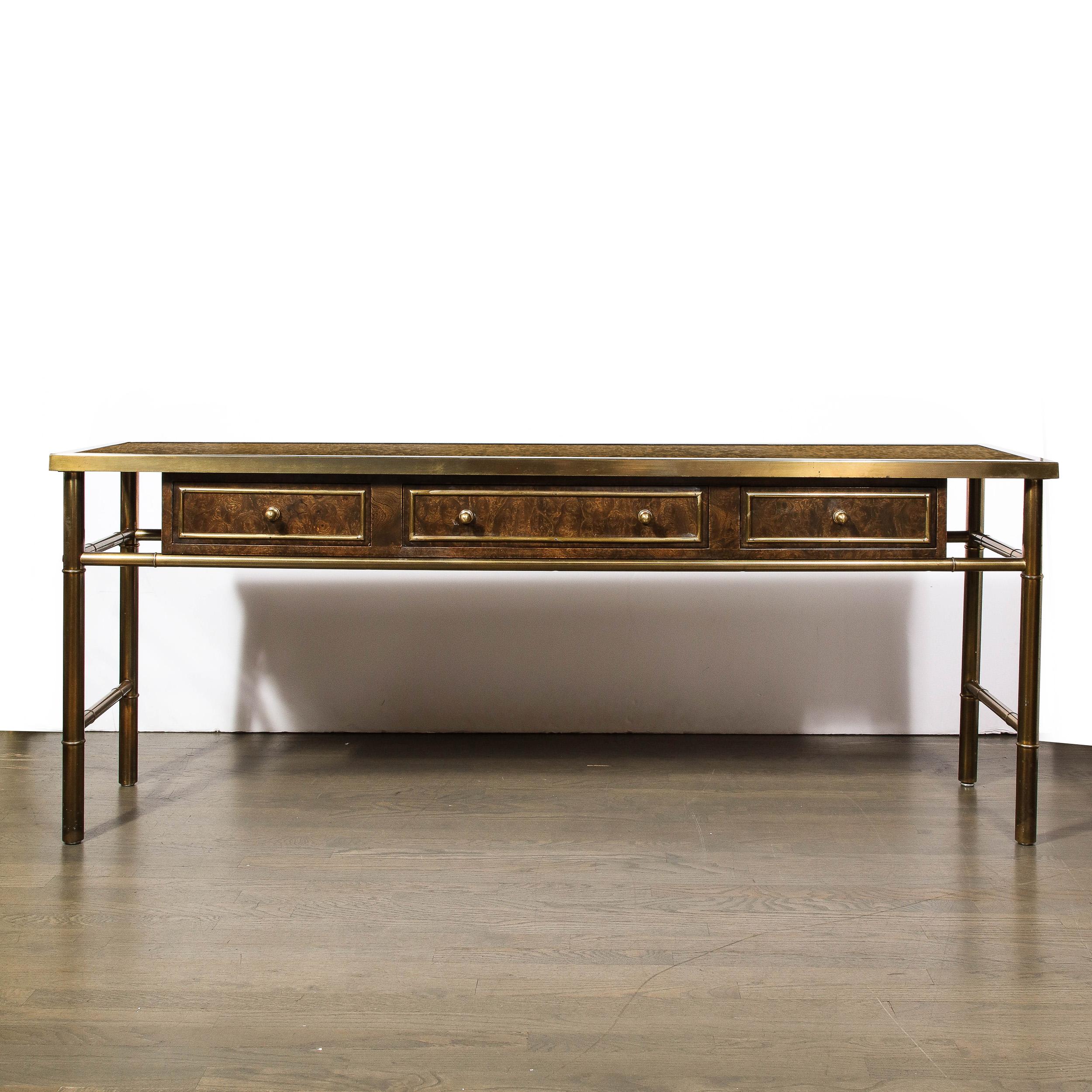 -This lovely and materially dynamic Mid-Century Modernist Console table in Brass and Burled Carpathian Elm is created by the company Mastercraft and originates from the United States, Circa 1970. A beautiful example of balanced material choices, the