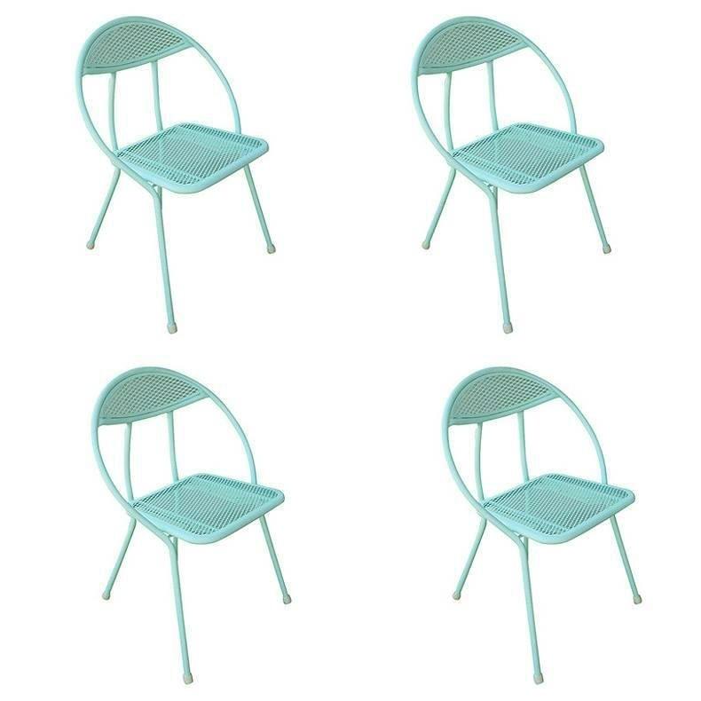 This Mid-Century aqua/turquoise outdoor folding dining set by Rid Jid features four rounded-back, folding chairs, and a rectangular dining table. The table and chairs are made of a combination of mesh and tubular steel all have been newly refinished