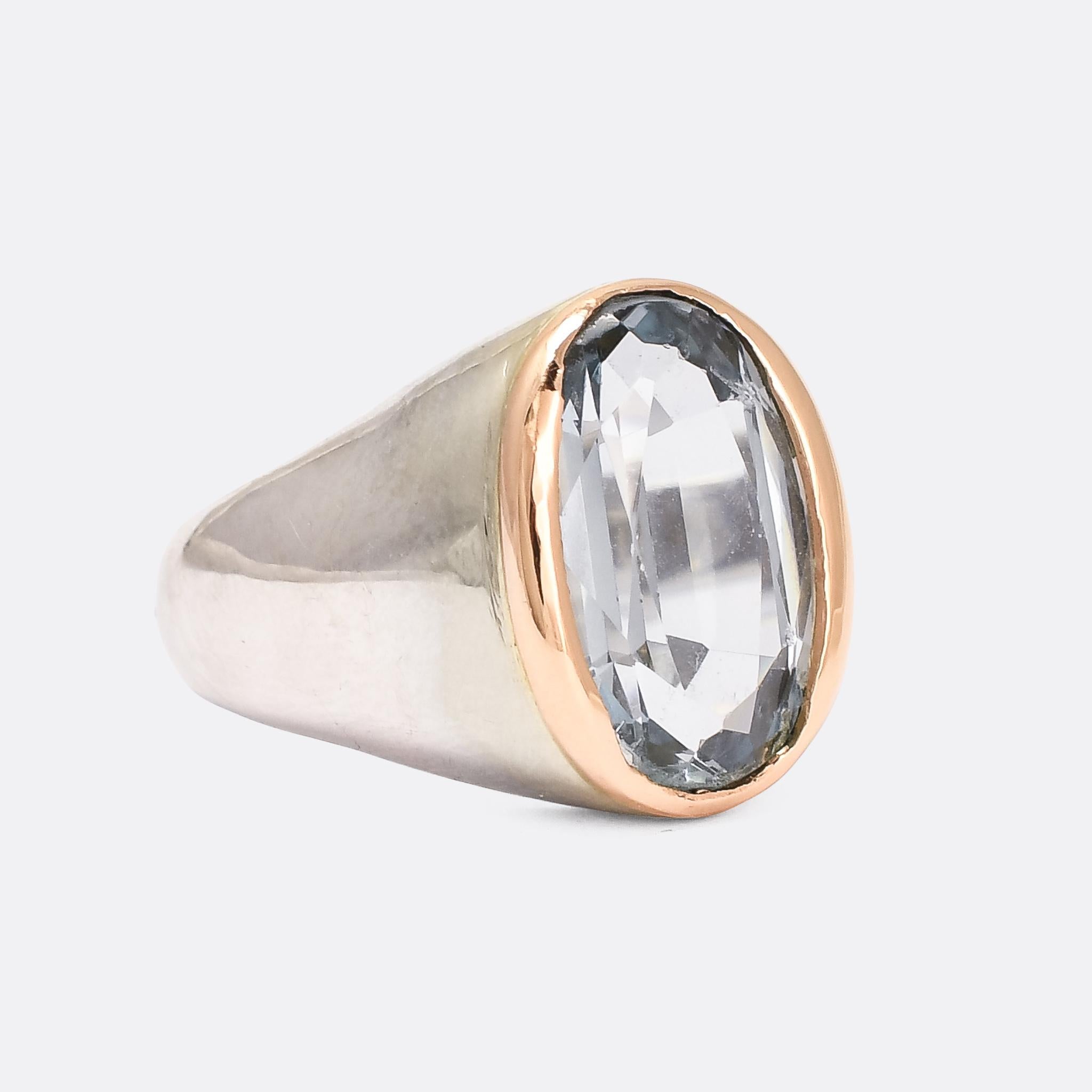 A stunning mid-Century signet ring set with a beautiful 9 carat aquamarine. The ring itself is modelled in platinum, with a rose gold bezel setting around the stone - a particularly attractive colour combination. It dates from the 1950s, with French