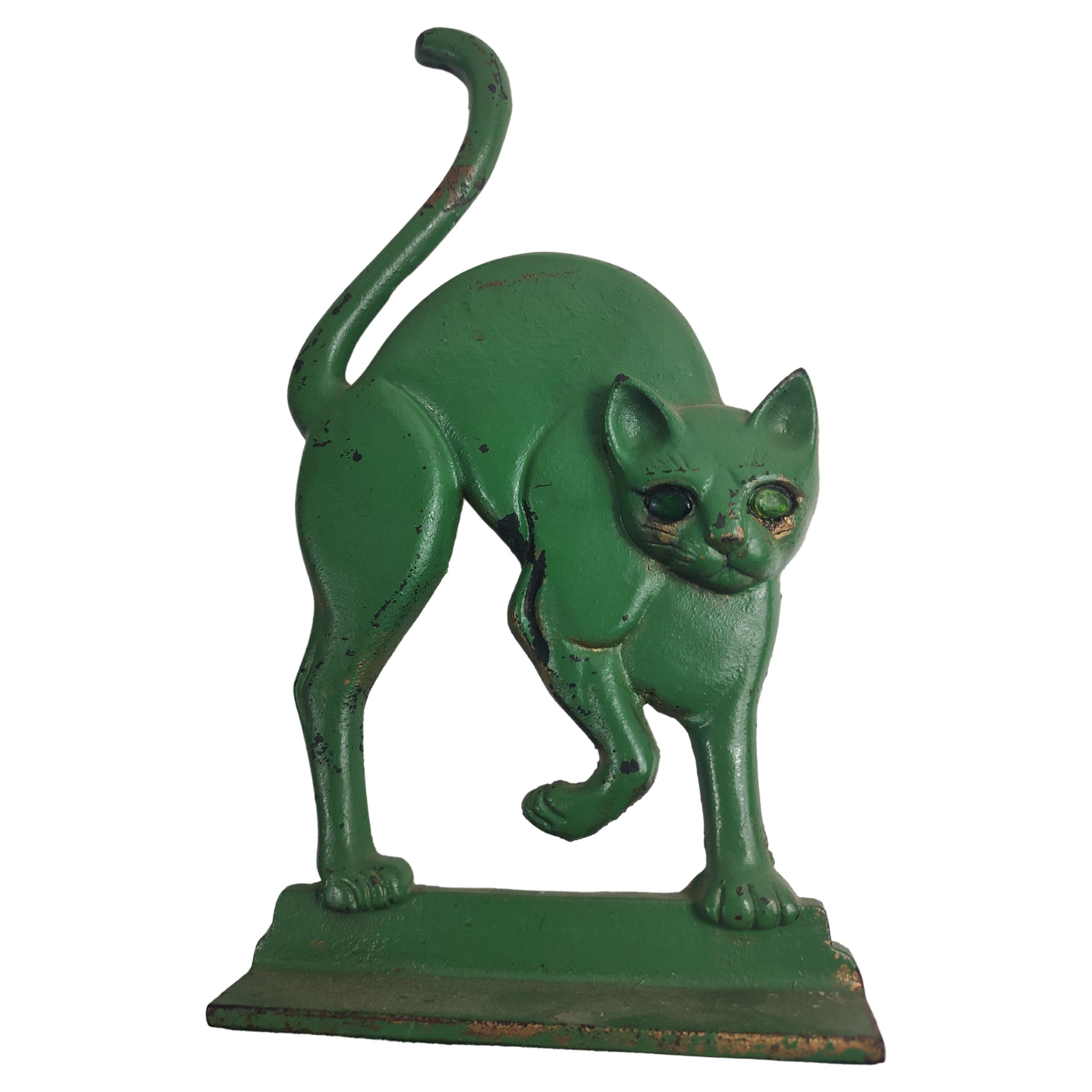 Fabulous style with arched back and tail with green glass eyes. Green is not original color. In excellent vintage condition with minimal wear.