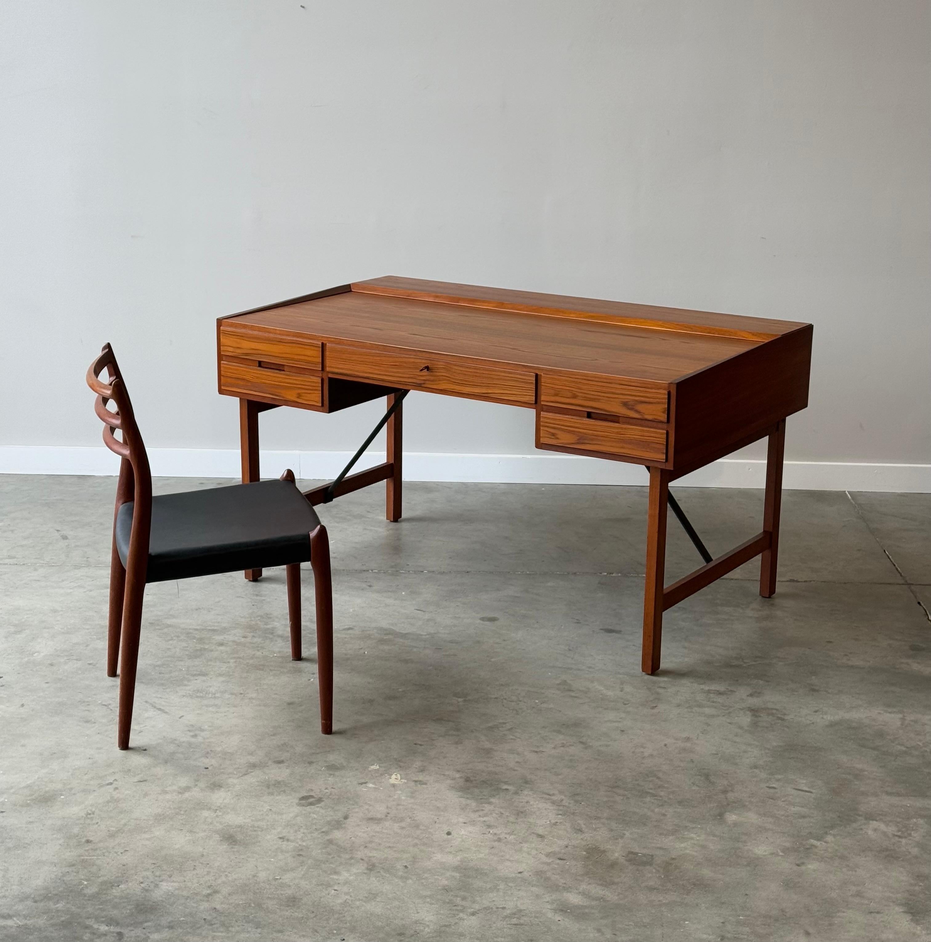 This seldomly seen designed executive desk by Svend Aage Madsen for Sigurd Hansens Møbelfabrik is truly a relic of design history. To my knowledge we are the only ones in the United States to offer one for sale currently. The desk is made of