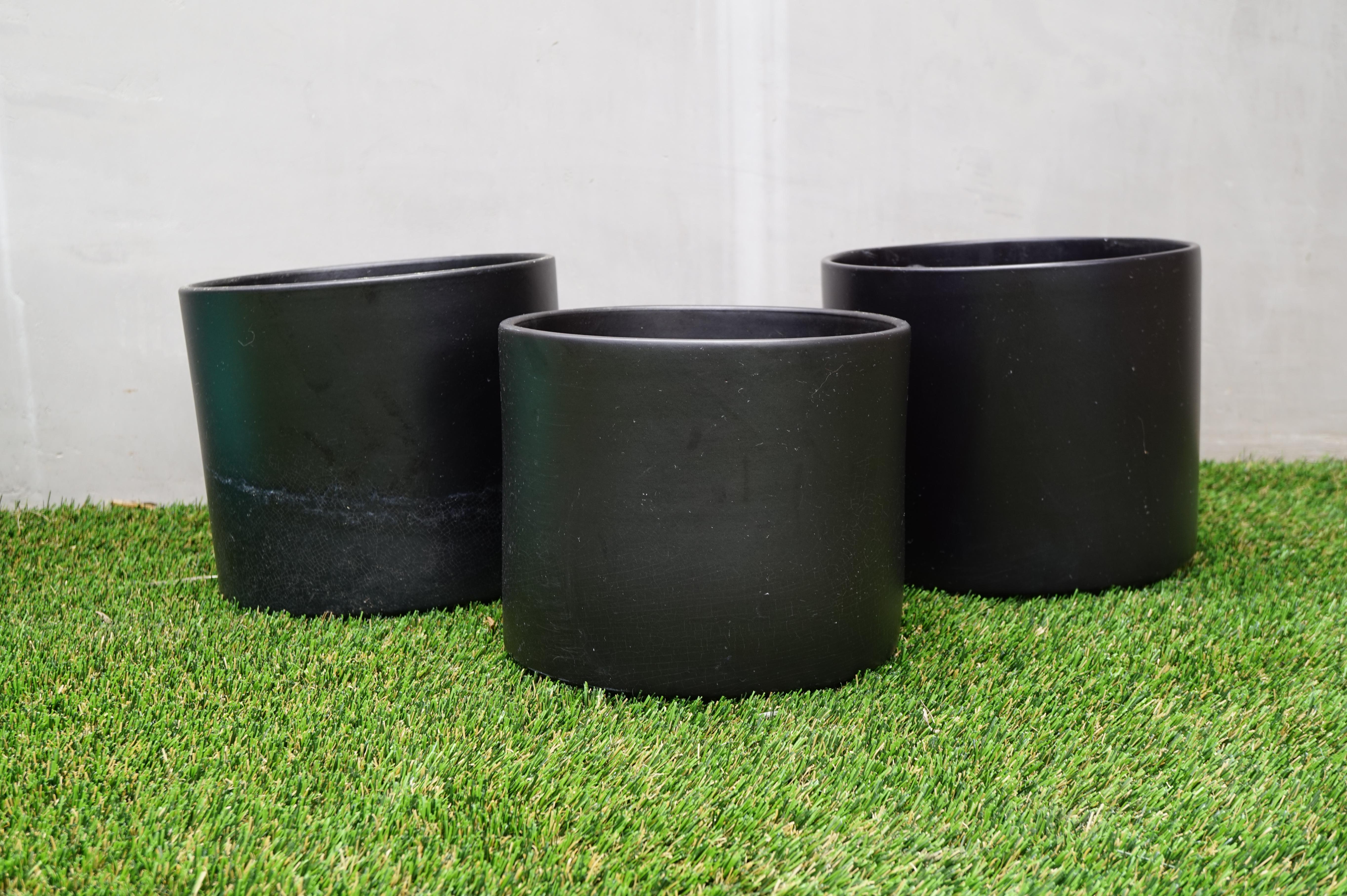 Set of three vintage MCM large black ceramic planter pots by Gainey

Two measure 9