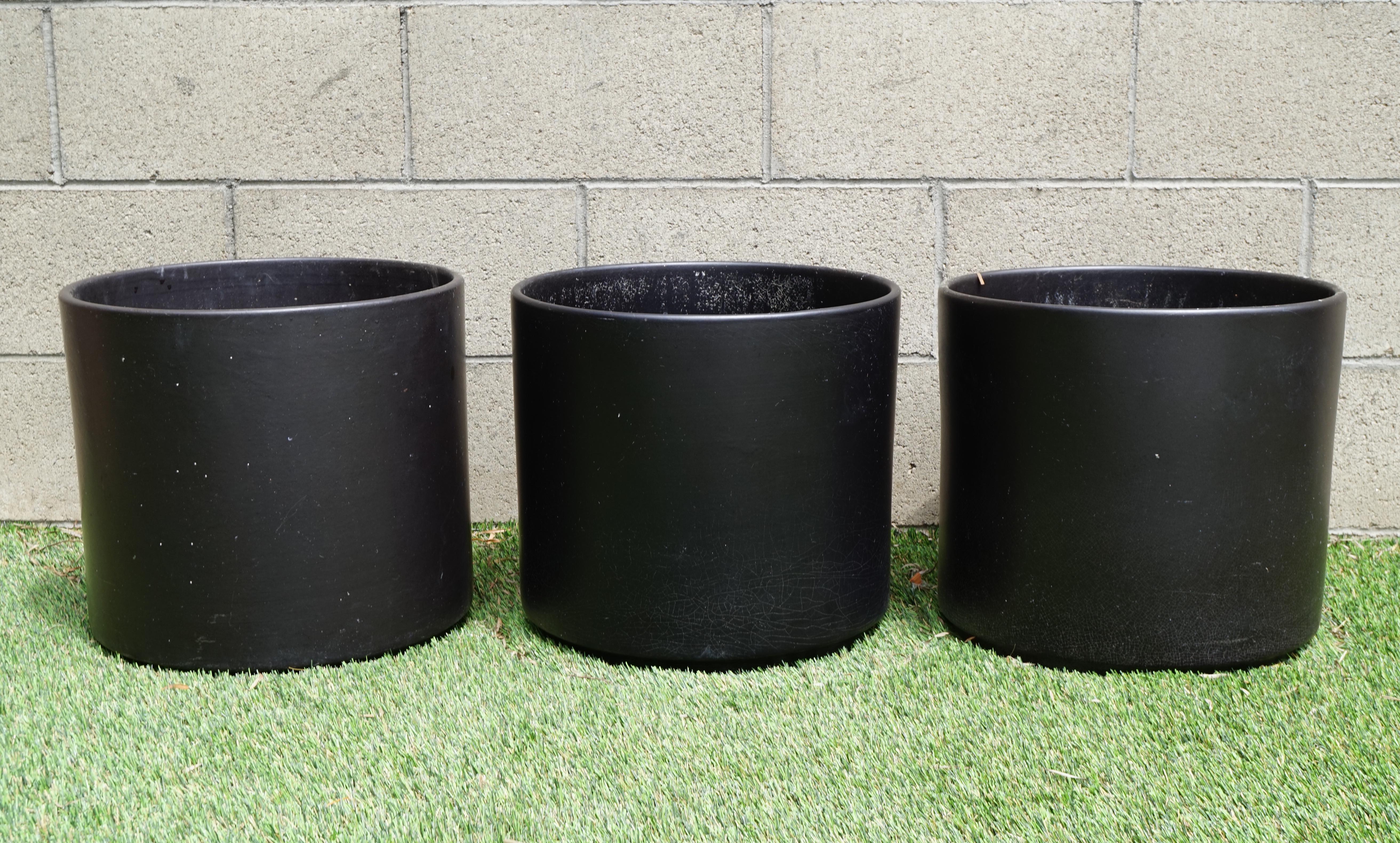 Set of three vintage MCM large black ceramic planter pots by Gainey

Each measures 13