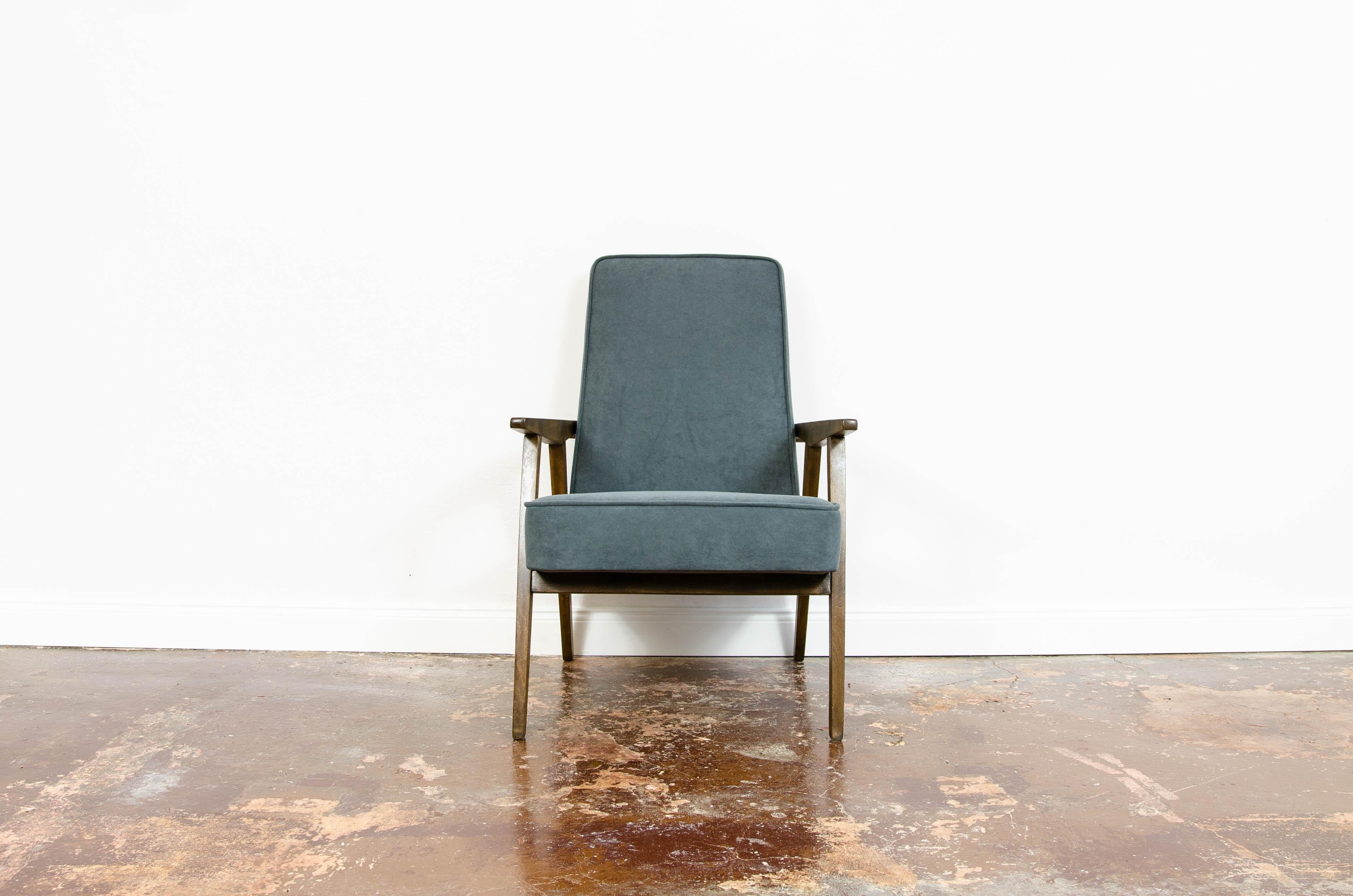 Restored vintage mid-century grey velvet armchair, 1960s Poland.

Mid-century armchair manufactured in Poland. 
Solid beech frame have been completely restored.
Reupholstered in soft grey velvet.