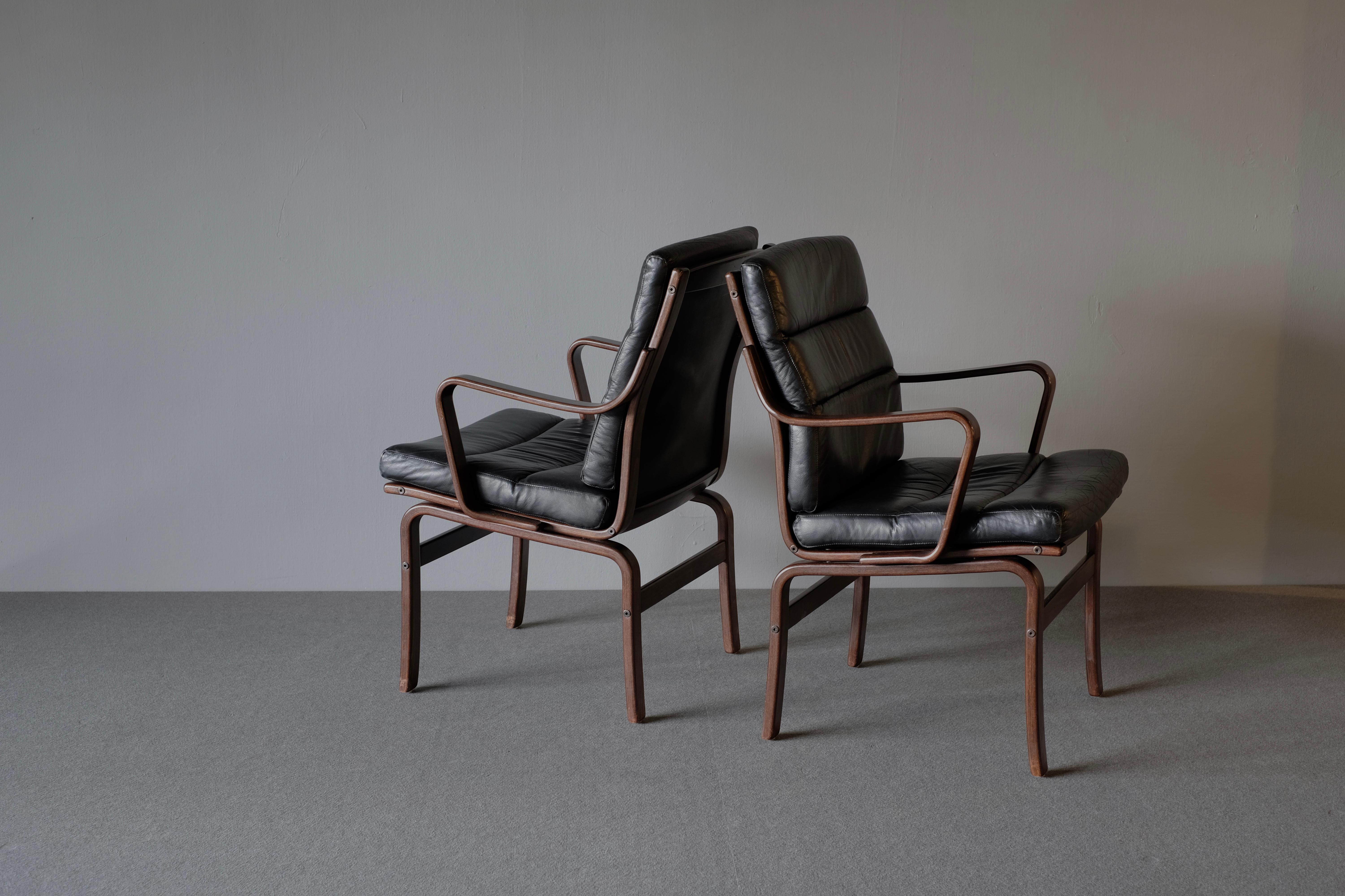 Wonderful armchairs circa 1970s-1980s. It has a wooden frame and is upholstered in wonderfully patinated black leather. The makers stamp remains on the frame.
Seat height 42 cm

Available singly. Price is for one.
   