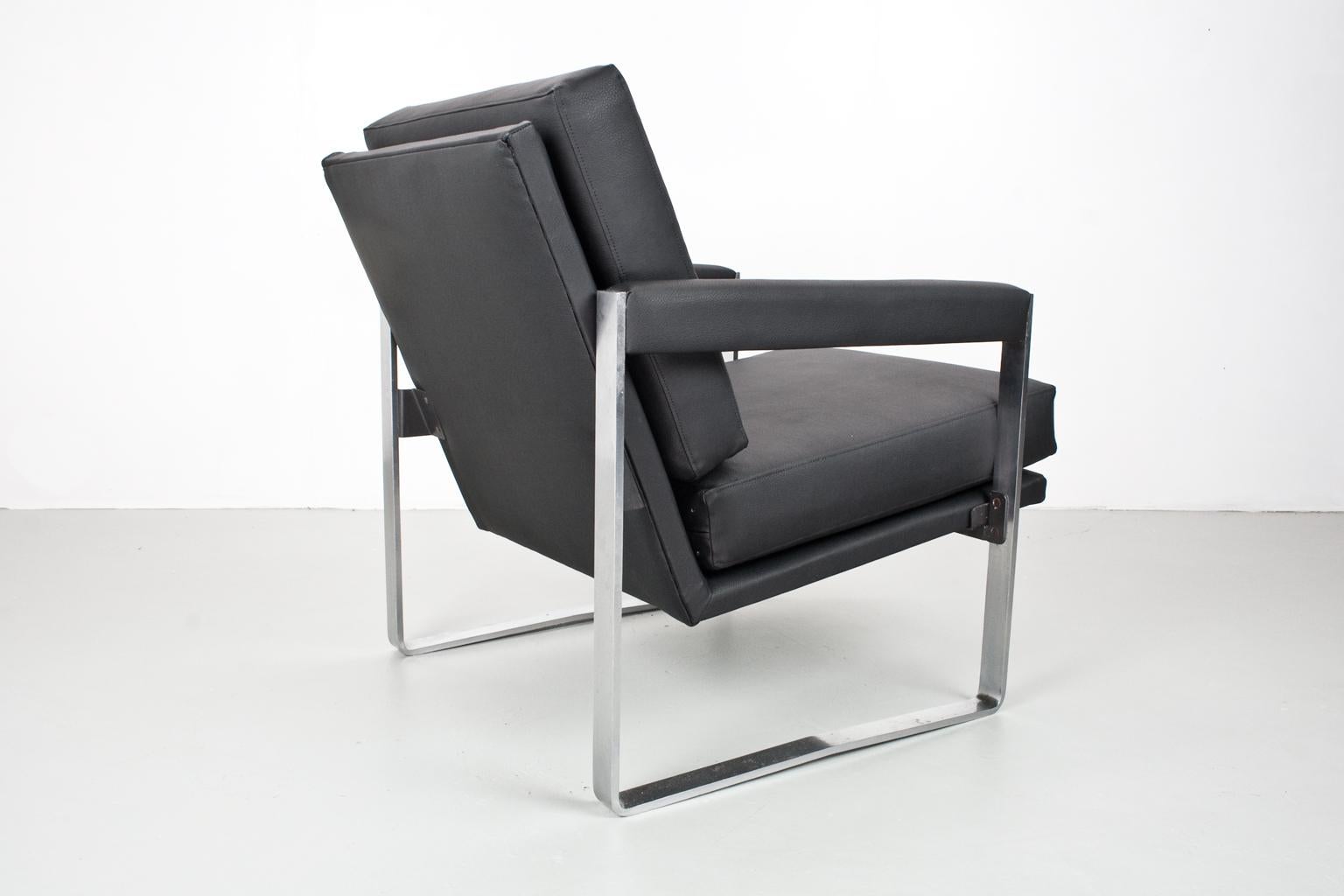 Mid century Dutch armchair for Polak, model AP 72. Designed in 1968 by Hein Salomonson for AP Originals / Polak. The item is new upholstered in a good quality black and soft faux leather, chromed metal frame in original condition with traces of use