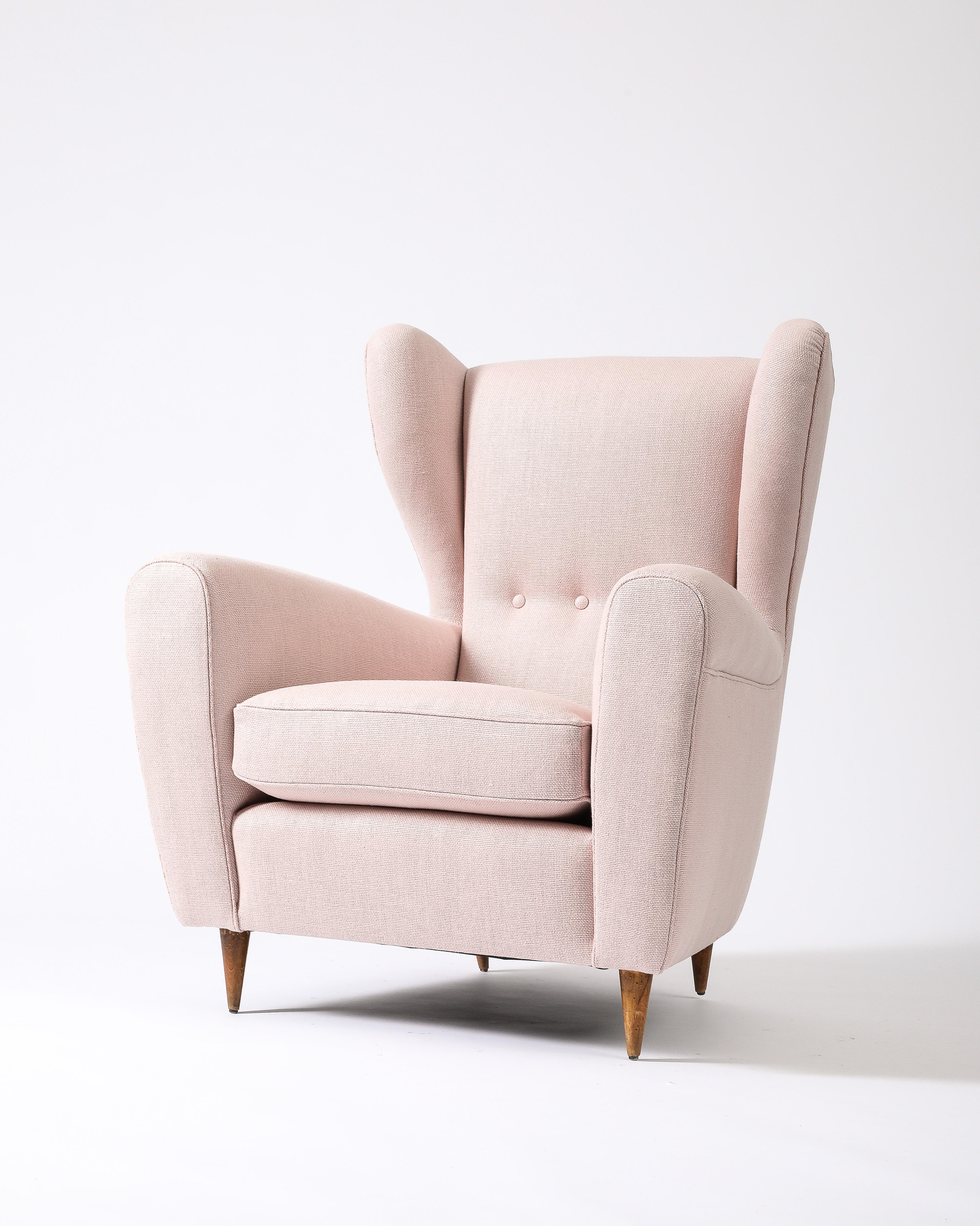 Upholstered mid-century armchair by Paolo Buffa.

