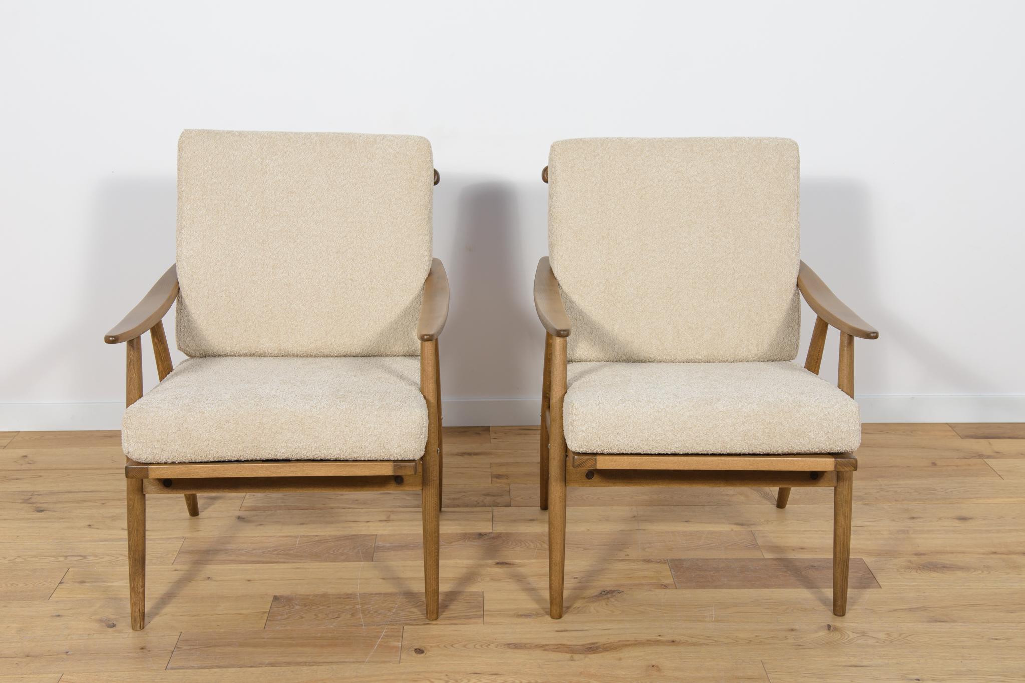 This pair of armchairs was produced by the Czechoslovak company TON in the 1960s. The beech elements have been cleaned from the old surface and painted in a walnut stain and finished with a strong semi matt lacquer. The pillows have been replaced