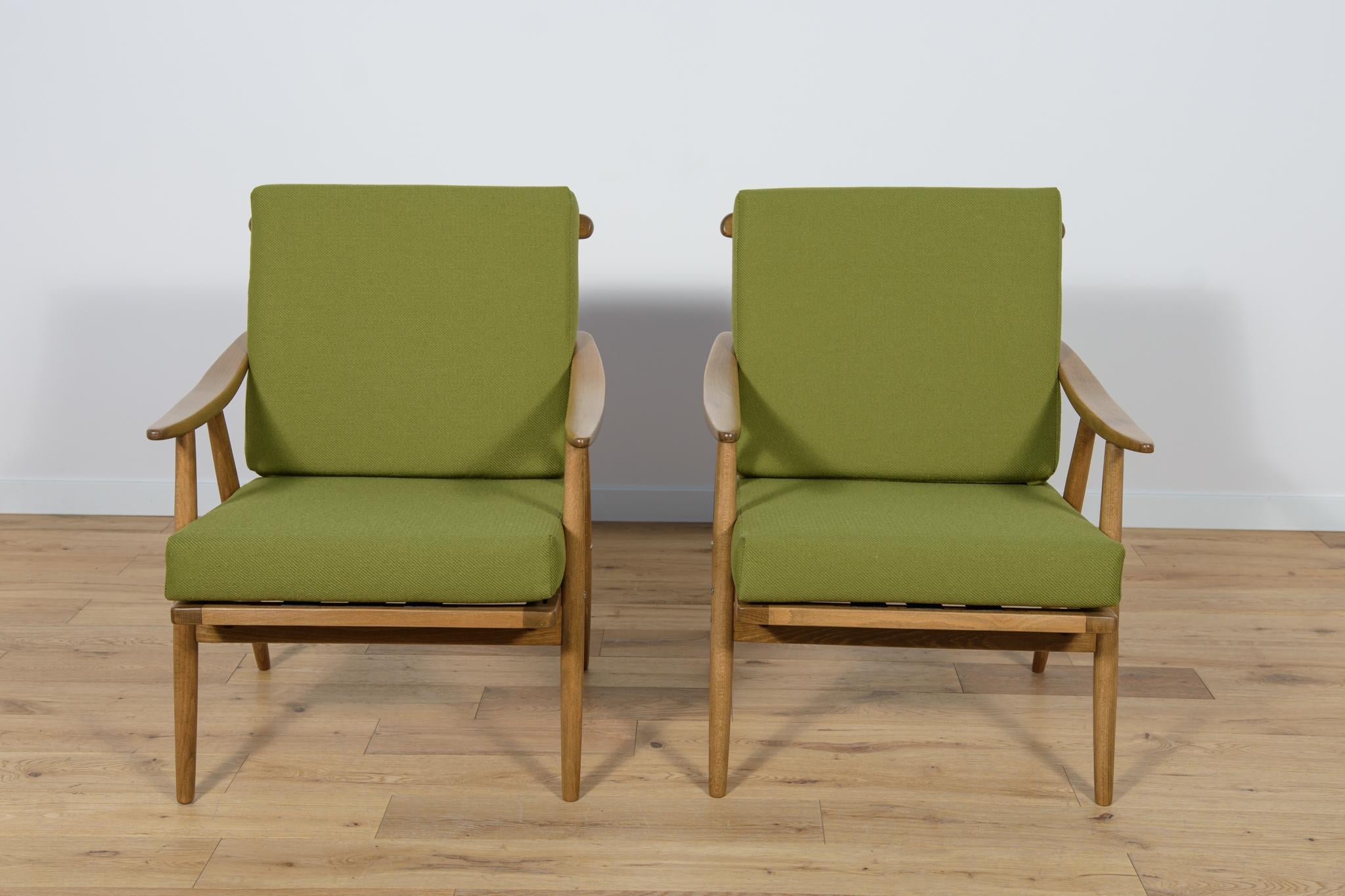 This pair of armchairs was produced by the Czechoslovak company TON in the 1960s. The beech elements have been cleaned from the old surface and painted in a walnut stain and finished with a strong semi matt lacquer. The pillows have been replaced