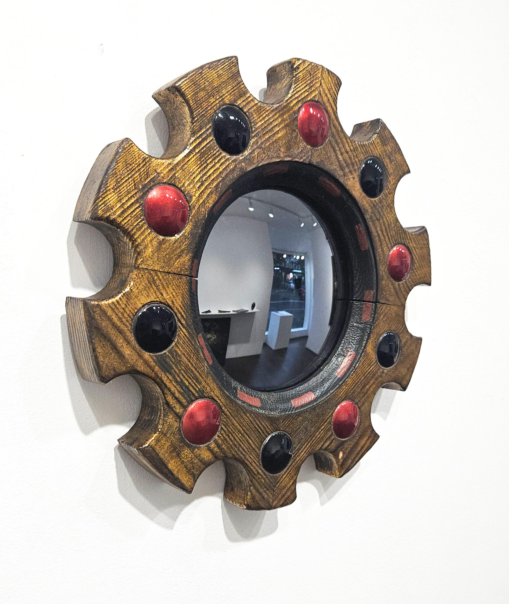 A fantastic small size mid century ‘Arnolfini’ style witch’s mirror in the Renaissance Revival style with an old gold painted wood frame and enamel cabochons, made in Spain c. 1950. 

The mirror is convex and has a slightly dark tint which works