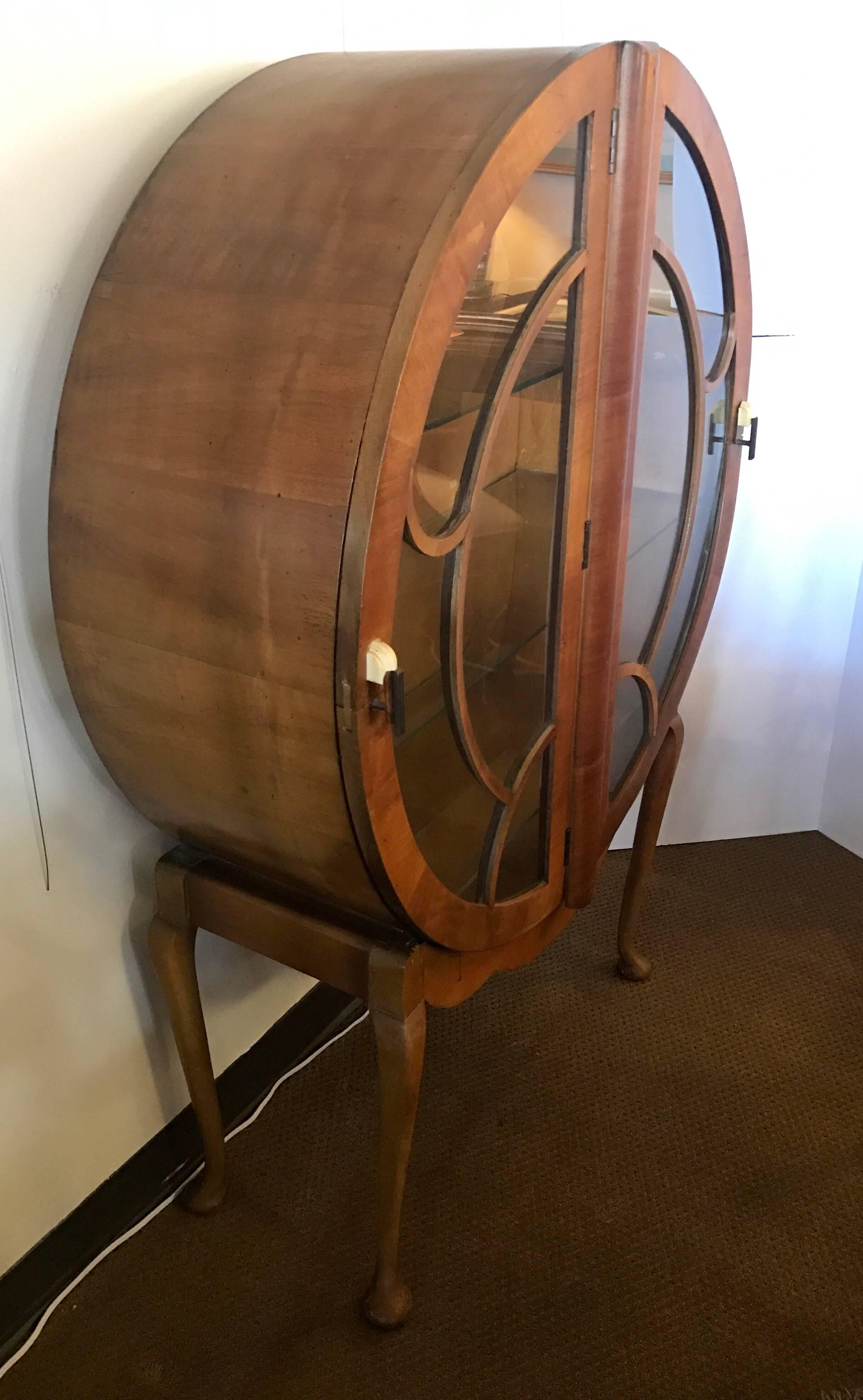 Circular 1930's art deco drinks cabinet by H & L Epstein with signature bakelite handles.
Can be used as a bar or cabinet to showcase your collectibles.