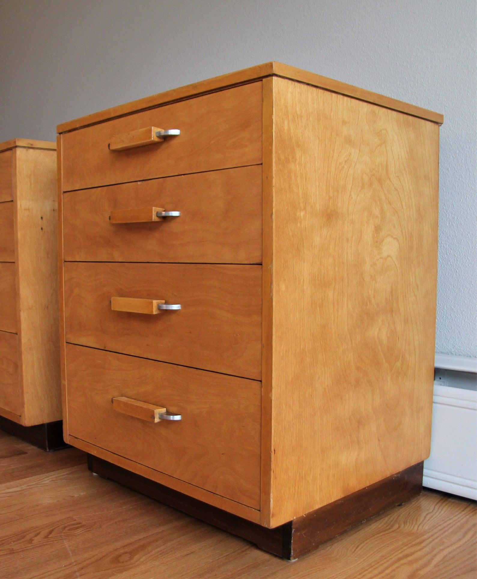 A set (2) of matching nightstands or small chest of drawers by John Stuart for Johnson Furniture. The design is from the FHA (Flexible Home Arrangement) a modular collection by Eliel Saarinen. However, these pieces are by John Stuart, perhaps in