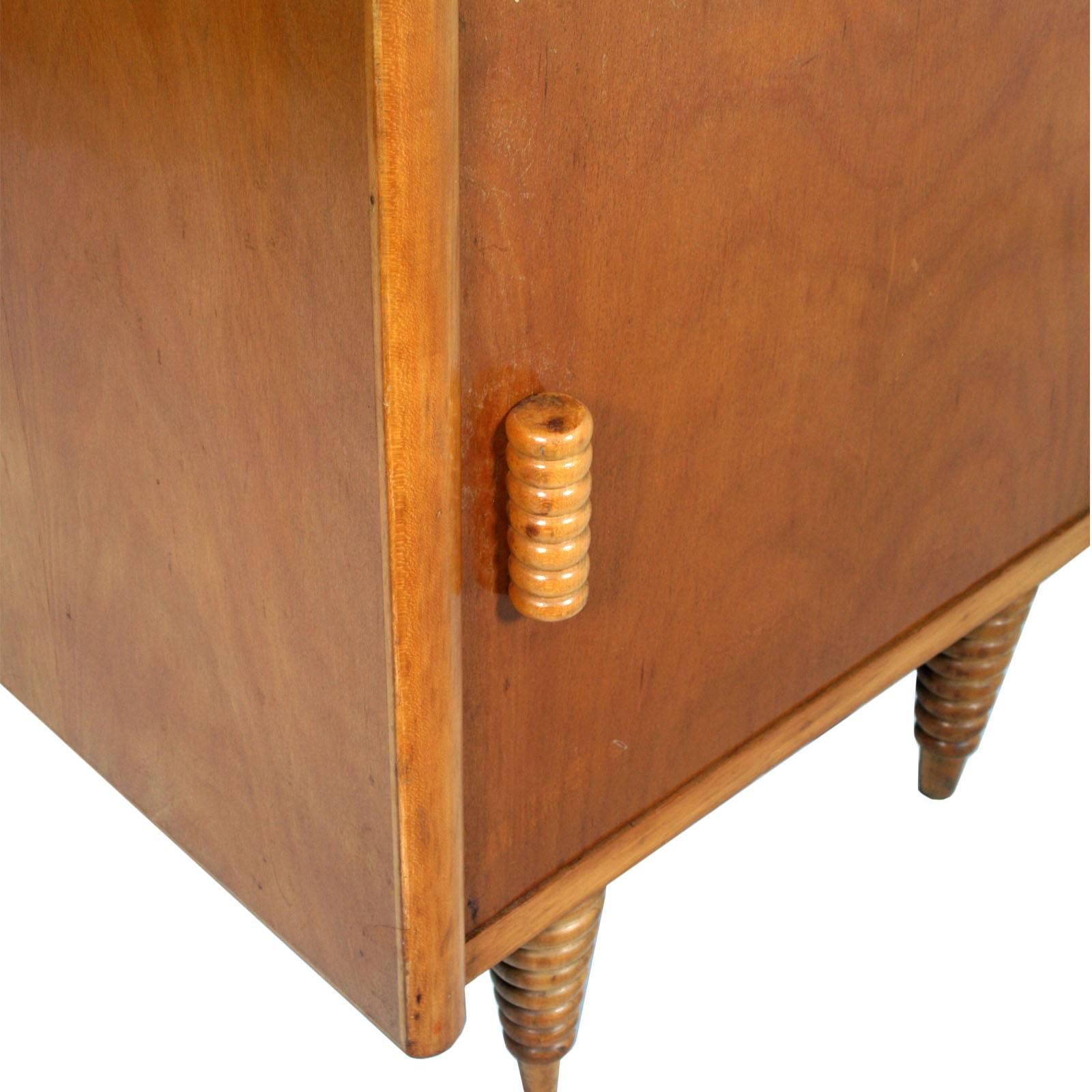 Italian circa 1930s Art Deco nightstand, Consorzio Esposizione Mobili Cantu, Gio Ponti attributed, in blond walnut and turned beech, polished to wax
Measures cm: H54\62, W 45, D 35.

About this Gio Ponti's cabinet

This Ponti cabinet expresses all
