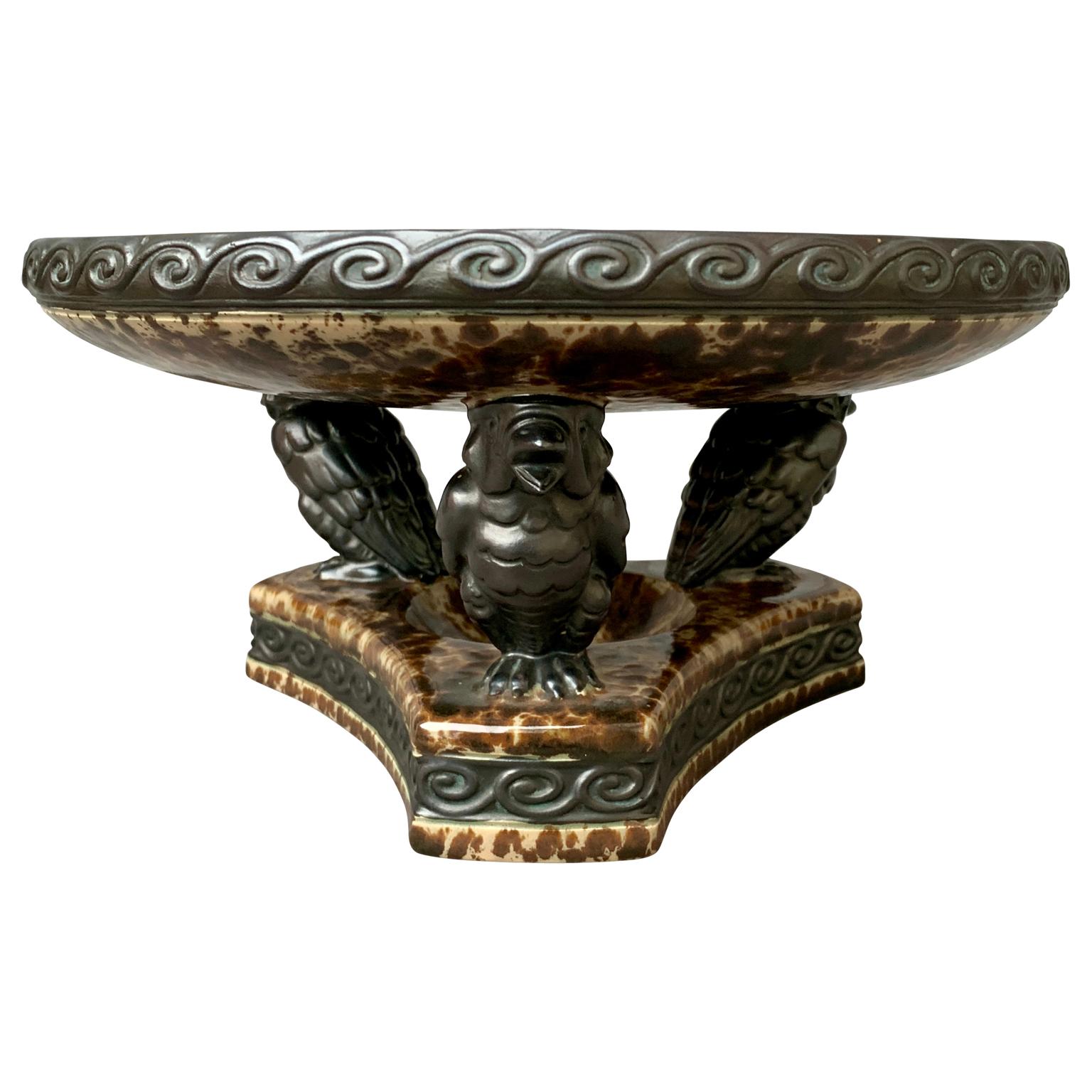 Amazing in design and execution, this Art Deco compote features three charming birds supporting a polychromed fruit bowl or sculpture. This bowl, acquired in a collectors home in Belgium, makes an impressive centerpiece on any formal or informal