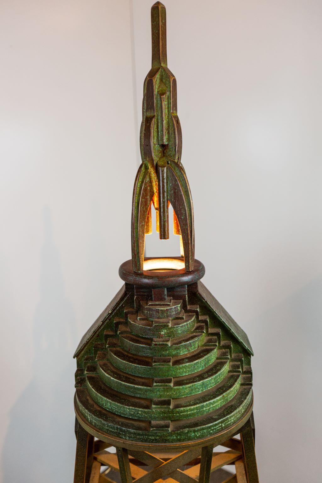 Magnificent mid century Art Deco skyscraper rocket Folk Art wooden floor lamp. Skyscraper light fixture and rocket sit atop of an incredibly detailed crisscross framework. (Lamp contains original and working hardware). Dimensions: 64 inches high, 20