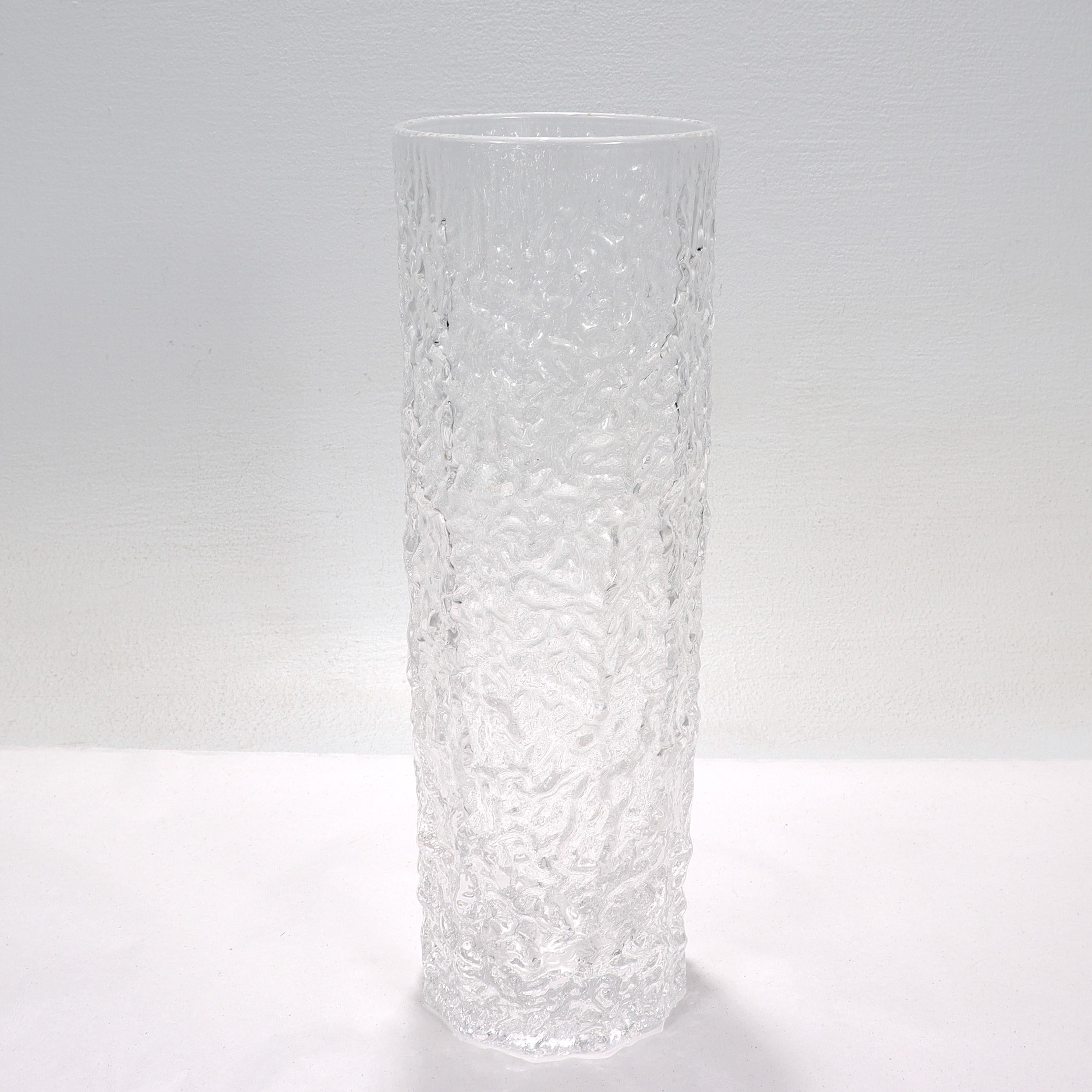 A fine antique Mid-Century Modern art glass vase.

Attributed to Geoffrey Baxter for Whitefriars. 

Baxter joined Whitefriars in 1954 and became well known for his design of textured vases, such as this one and 