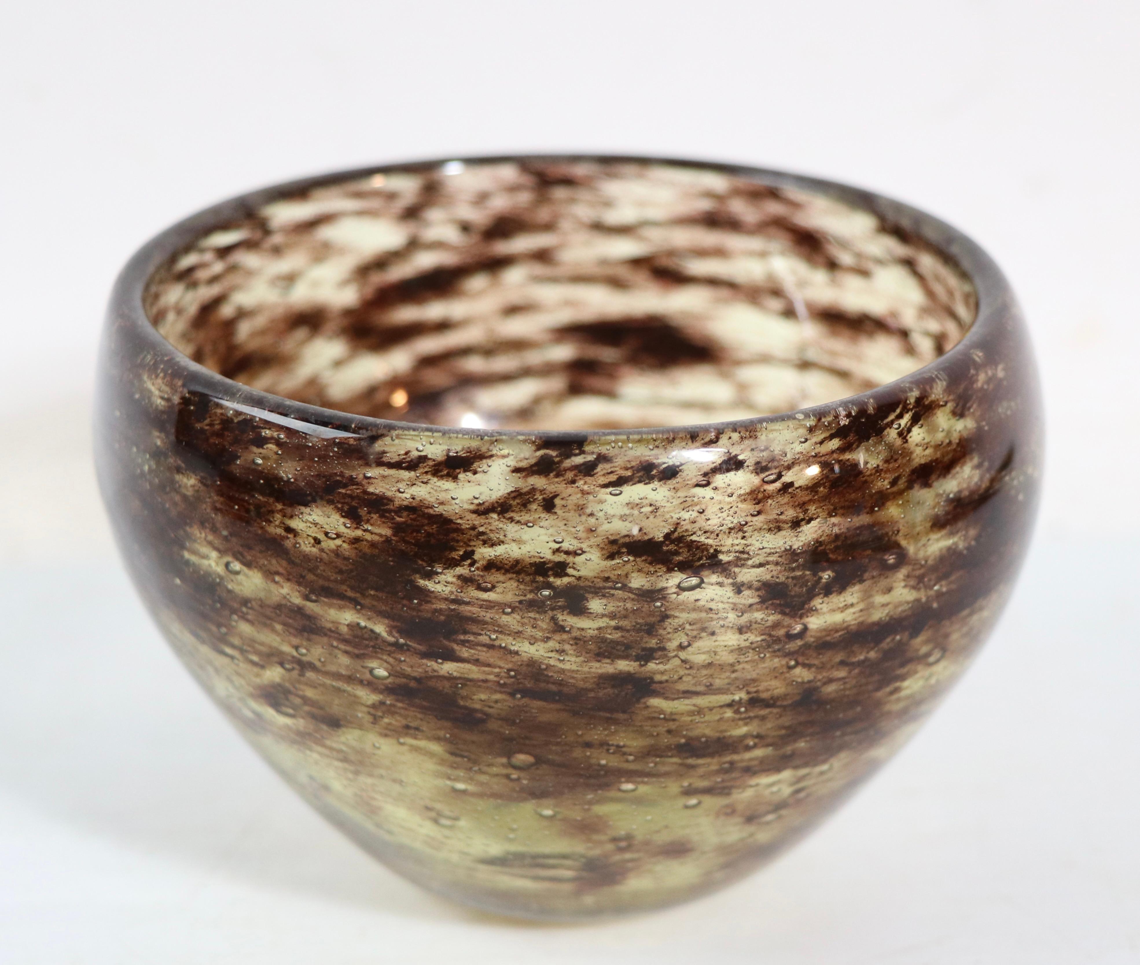 Mid century art glass bowl exhibiting an unusual and difficult technique, made in Sweden designed by Vicke Lindstrand for Kosta. This example is fully and correctly marked with etched signature on verso, and is free of any damage, chips, scratches