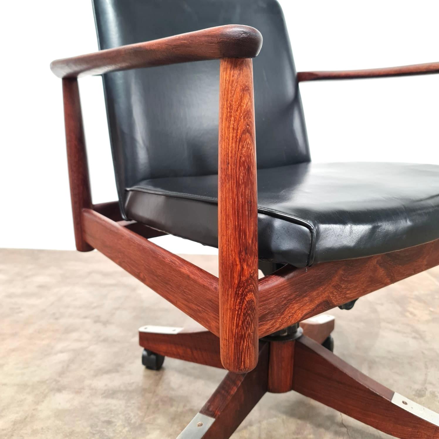 Lean back into a life of diplomatic trade agreements with this Arthur Stutchbury office chair. Blackbean frame with vinyl cushions freshly restored. Swivels, reclines and rolls.

Adjustable H 88cm, W 63cm, D 56cm

Located in Wollongong