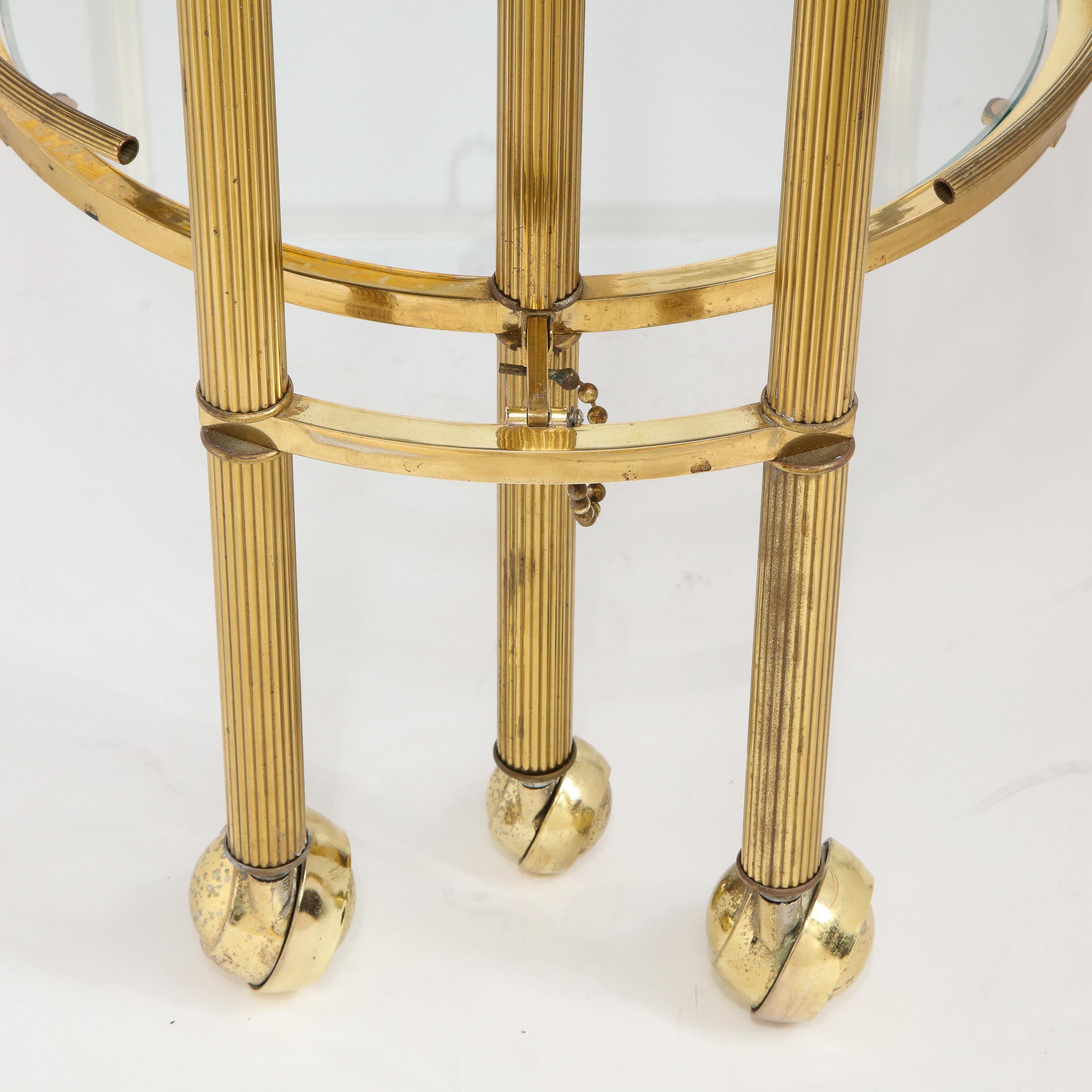 Midcentury Articulating 3-Tier Demilune Reeded Brass Bullet Bar Cart on Castors In Excellent Condition In New York, NY