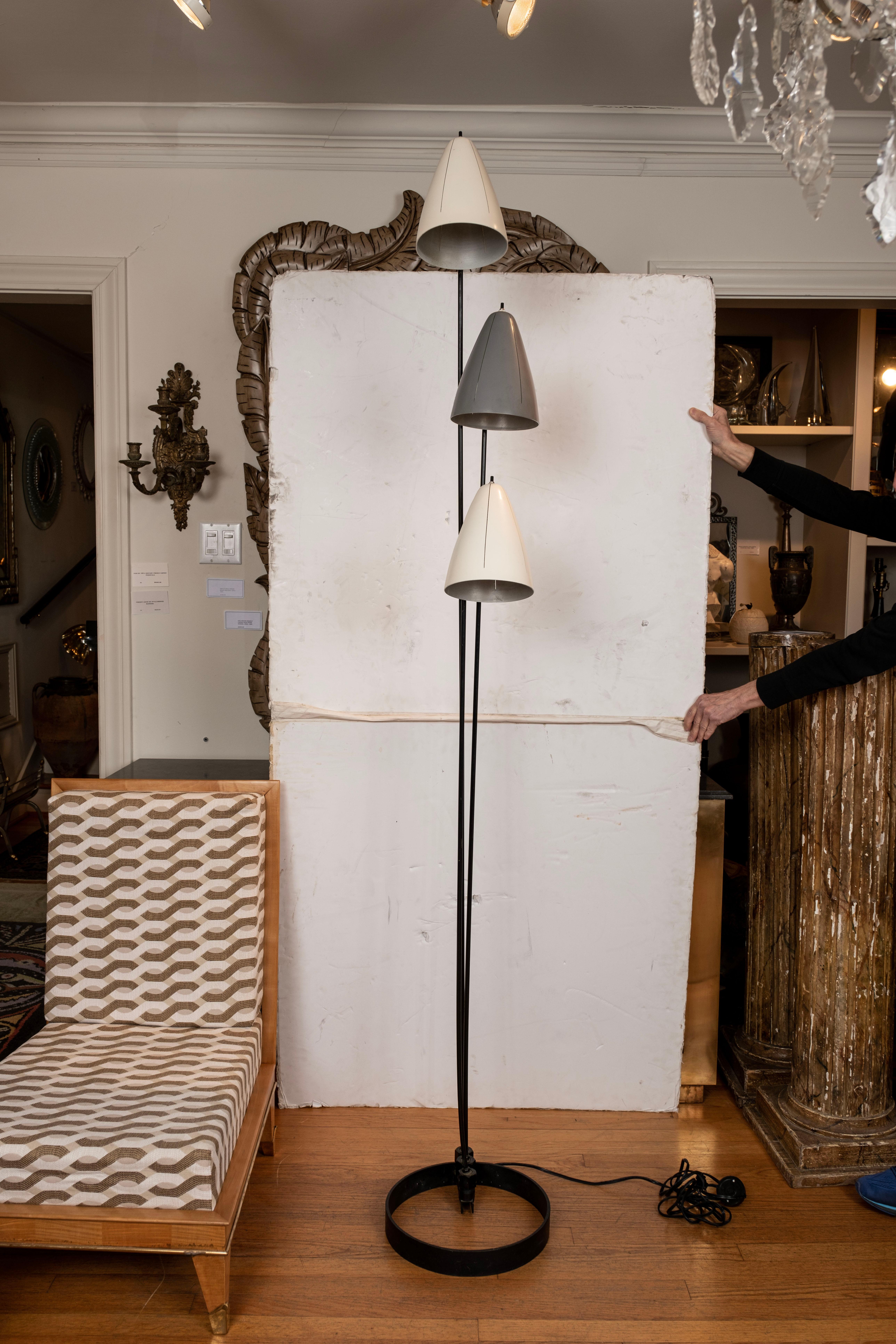  articulating floor lamp By Ben Seibel.
This rare mid century Ben Seibel designed floor lamp is constructed of iron with three cone shaped articulating lights.
Our Mid-Century Modern floor lamp is in original unrestored condition with light expected