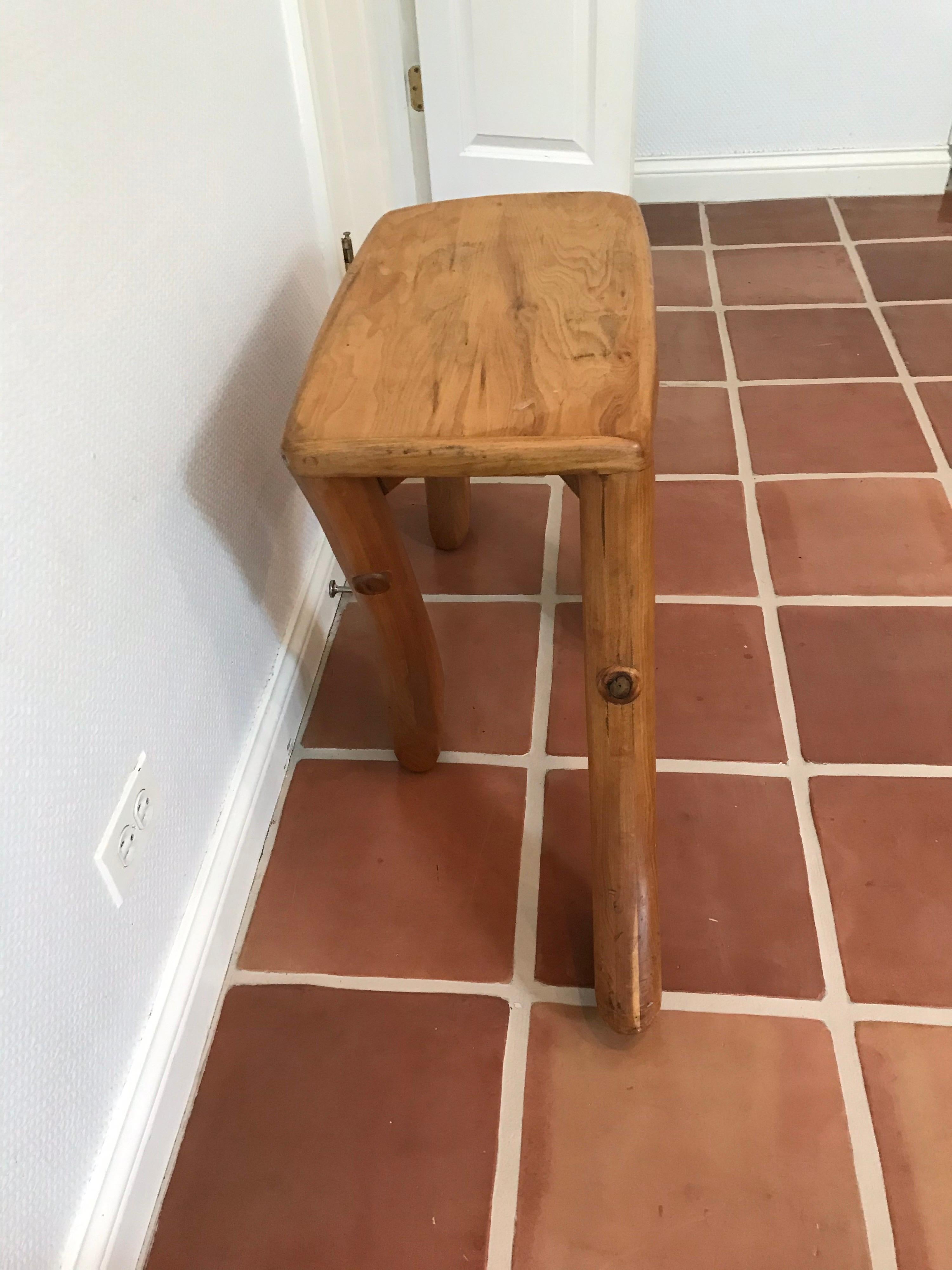 This is a cool handmade hardwood walking stool.