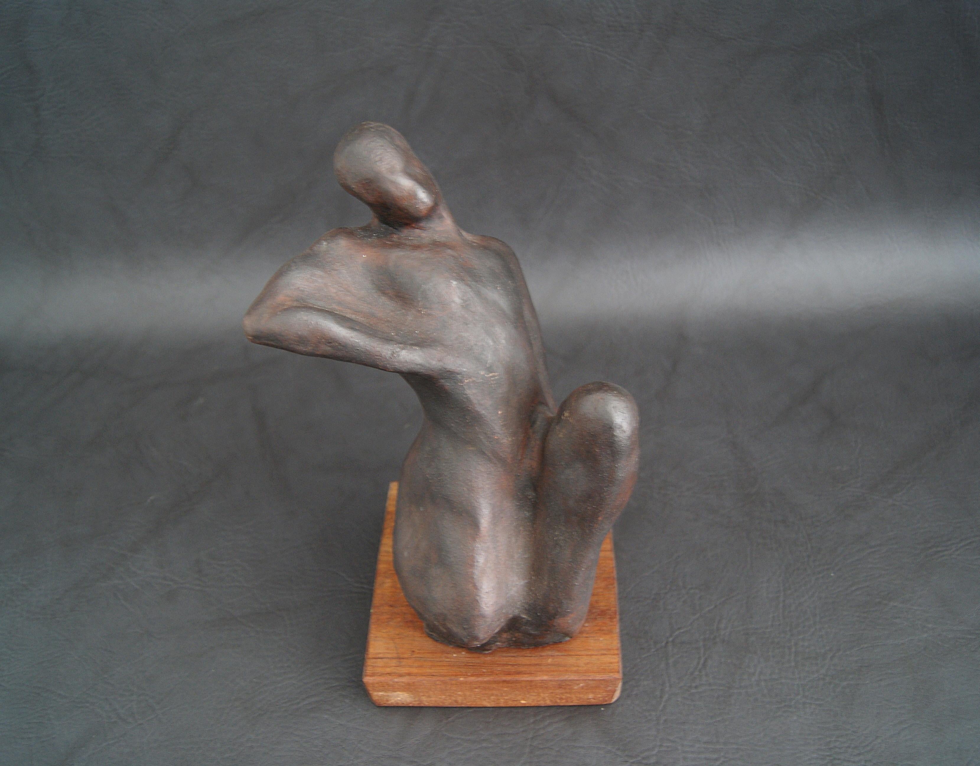 Hand-formed sculpture made of plaster of paris with patinated bronze on a wooden base. The plaster figure is from the German artist TADÄUS from the series formless body shapes from 2002. A very decorative individual piece that invites you to