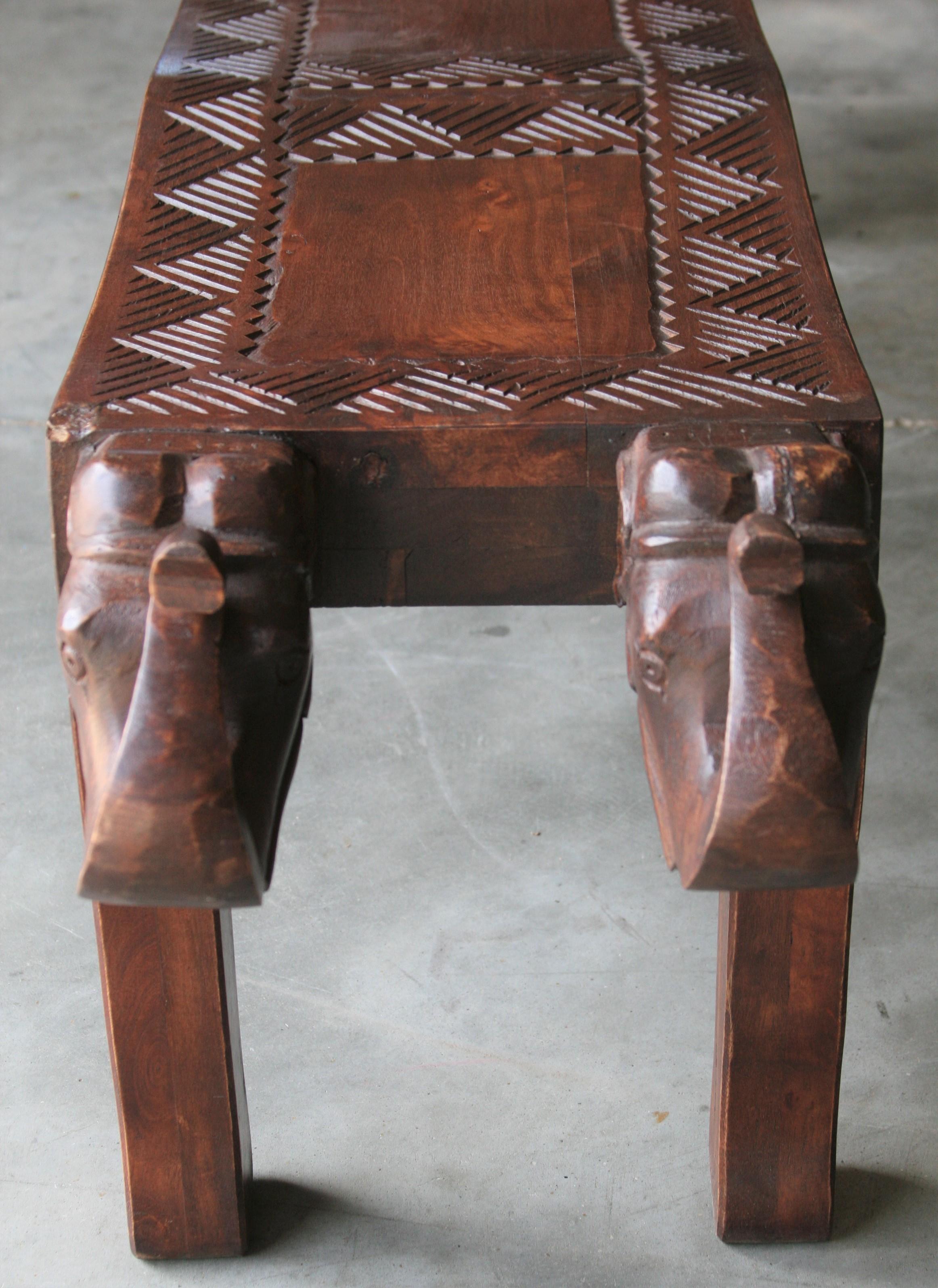 Indian Midcentury Artistically Carved Thick Seat with Elephant Heads on Either Side For Sale