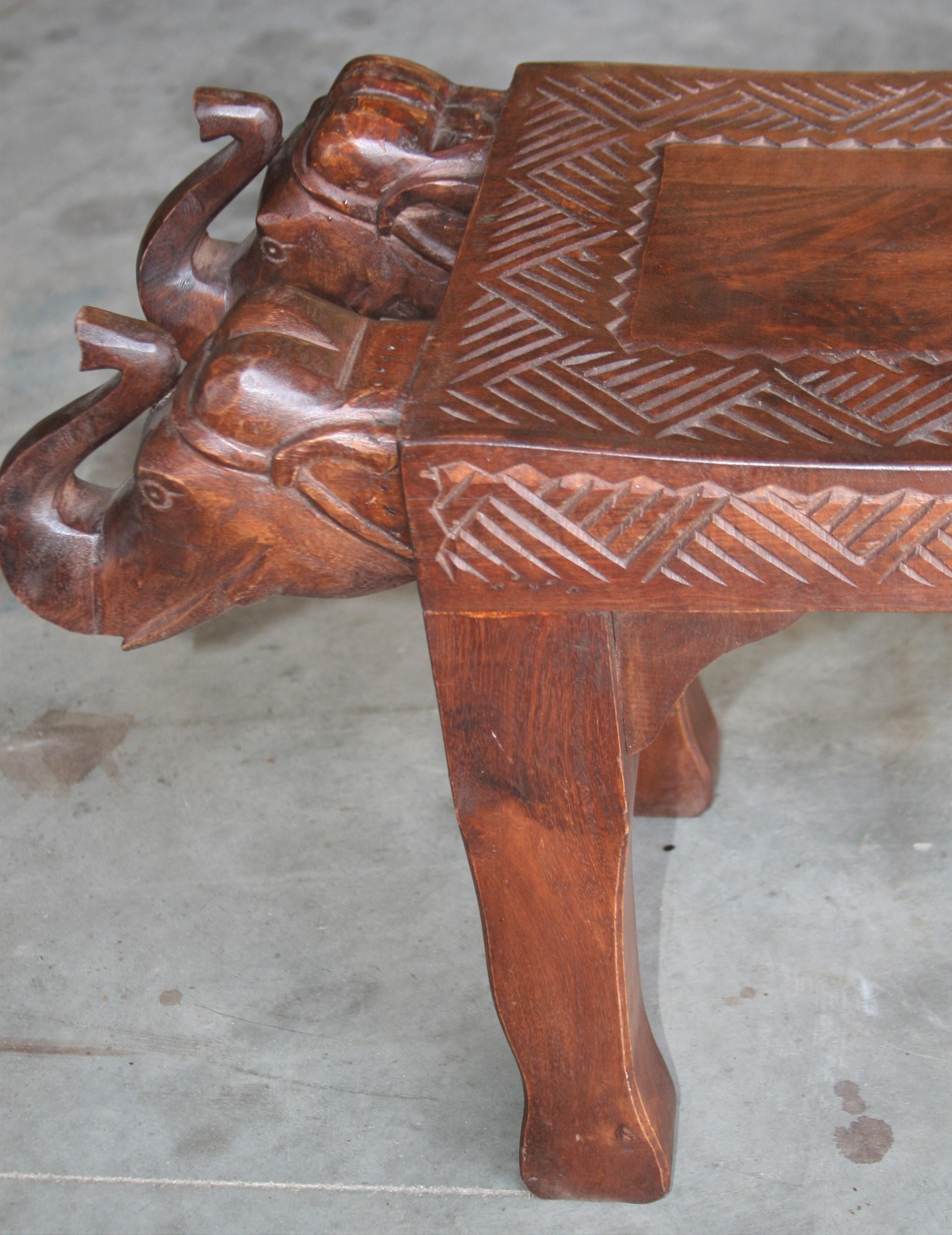 Midcentury Artistically Carved Thick Seat with Elephant Heads on Either Side In Excellent Condition For Sale In Houston, TX