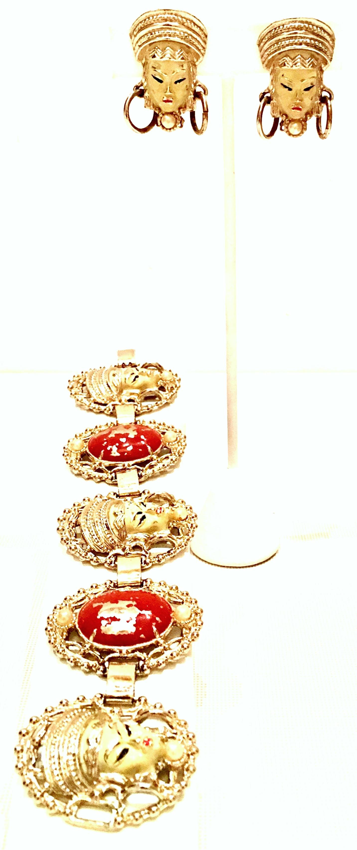 Mid-Century Selro style Asian Princess faux ivory and cinnabar gold plate five panel bracelet & Asian Princess Faux Ivory clip style earrings. The Asian Princes collection is well know for being unsigned but no doubt identifiable as Selro. The faux