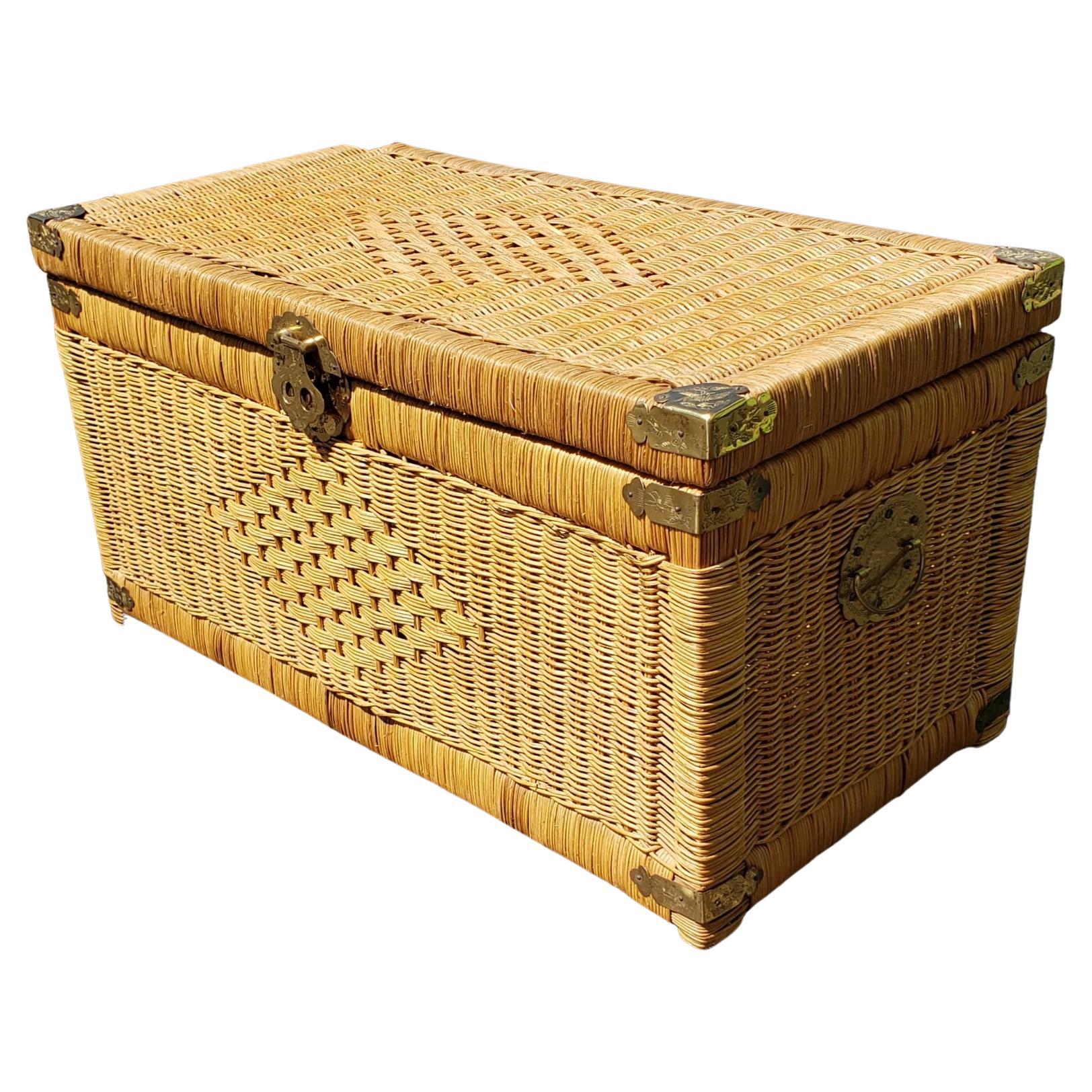 Midcentury Asian Style Brass Mounted Wicker Blanket Chest Storage Trunk in good vintage condition and measuring 36