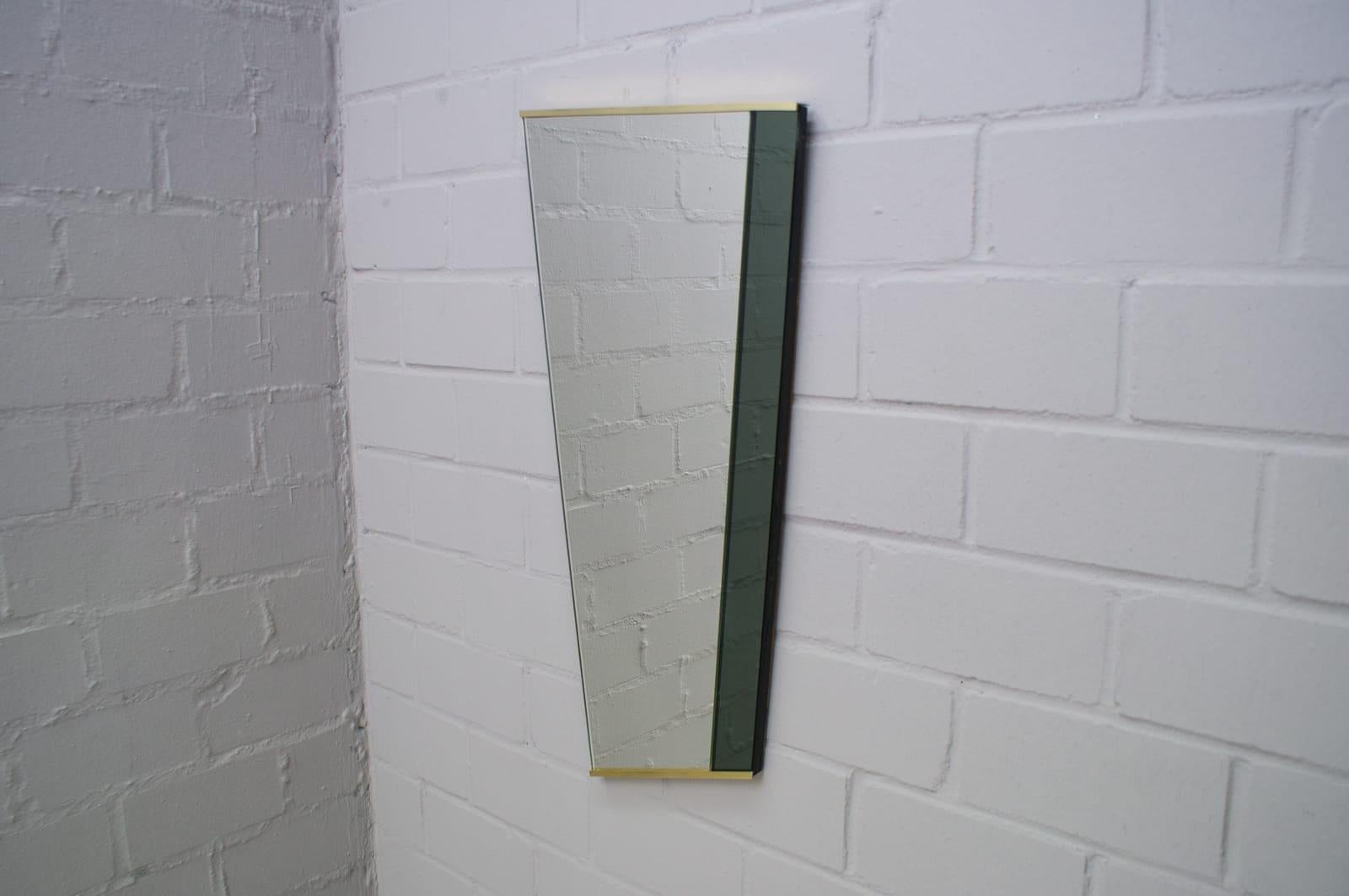 Midcentury asymetric wall mirror. In good original condition.



     