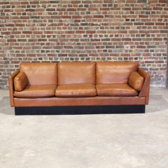 Mid Century asymetrical sofa in brown leather, scandinavian style