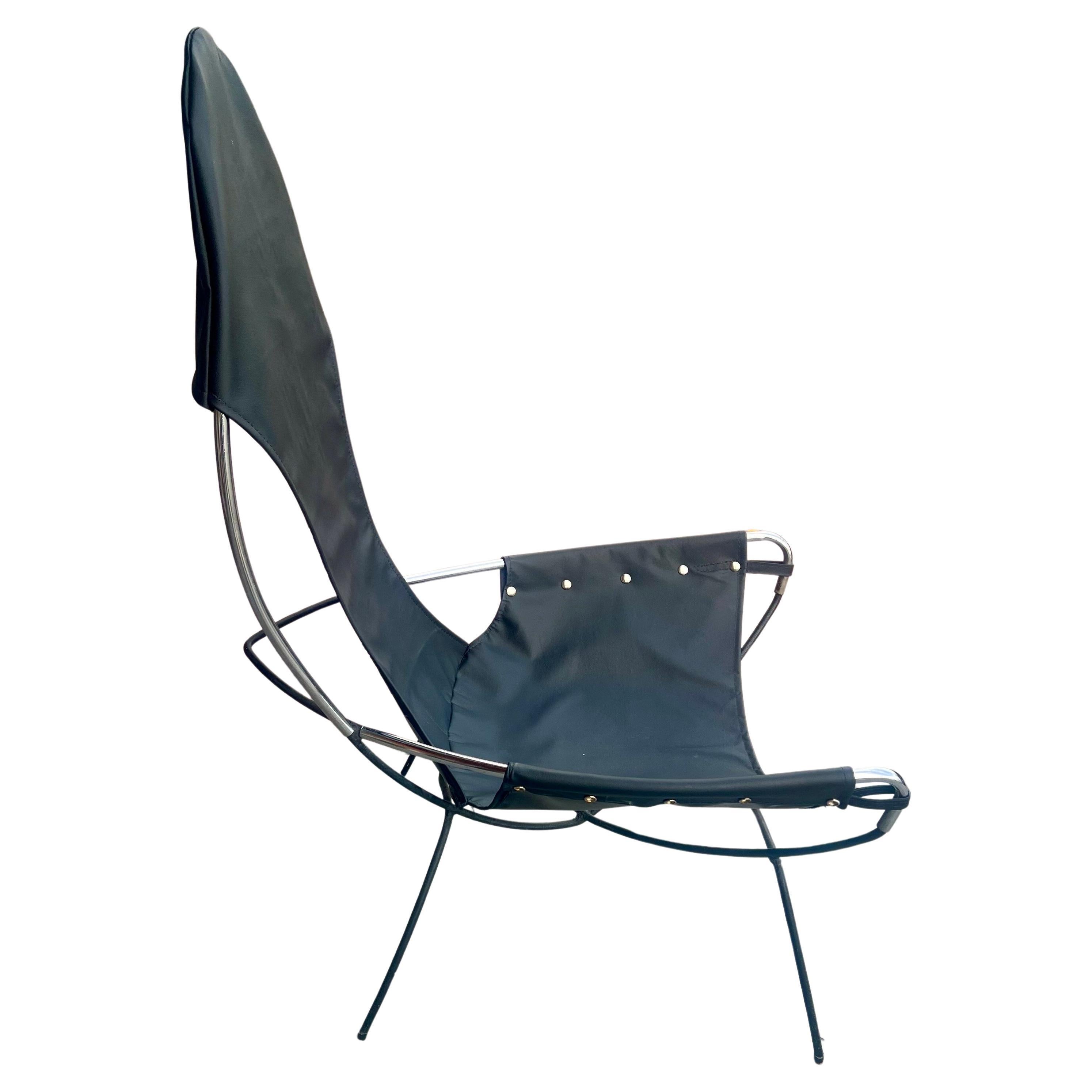 A unique single sling chair in chrome pipping, with a solid iron combination, Freshly Recovered in Black leather and riveted, the chair is in its original condition circa 1970s, the chair is comfy and light very clean condition.
