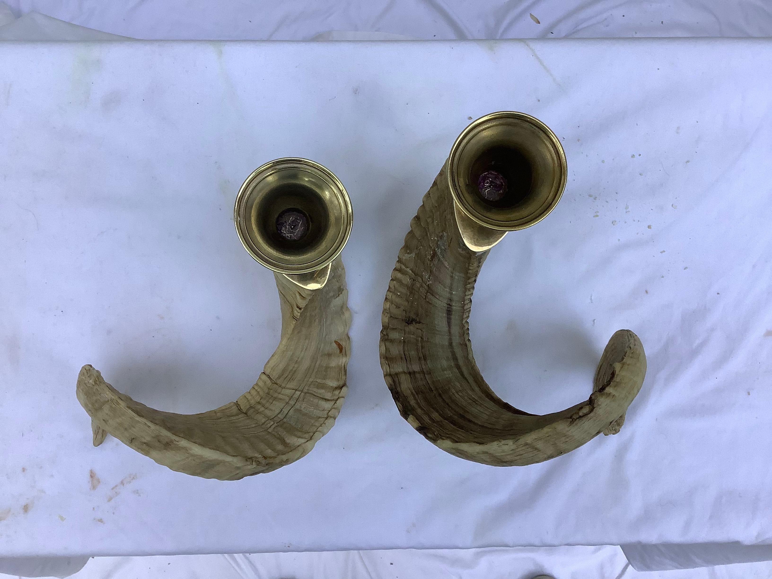 The candleholders are very reminiscent of Carl Aubock, who loved to work with horn &brass. Mid century, with original patina & wear. Very handsome!.