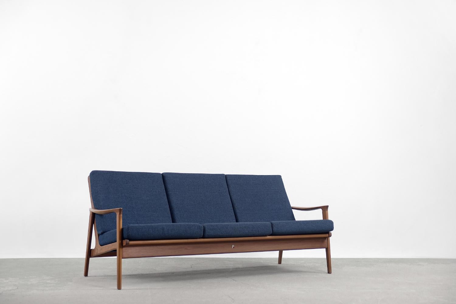 This impressive set of sofa and two armchairs was designed and produced by the Australian company Parker Furniture in 1956. Parker has a legacy of creating some of the finest Mid-Century furniture. These eco-friendly seats are no exception. In an