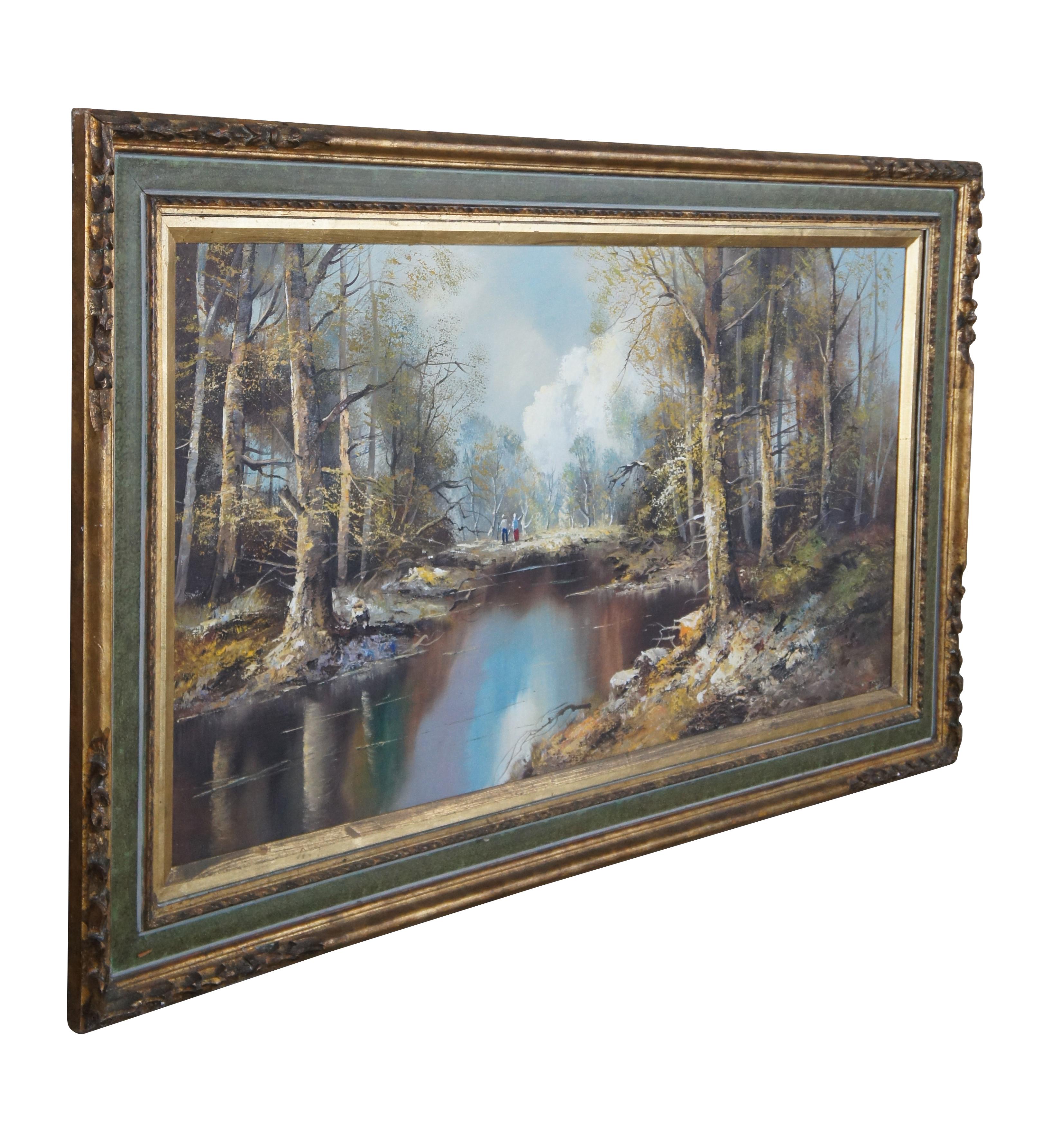 Mid 20th Century Realist Austrian oil painting, signed lower right Jacobs.  The painting features a woodland setting with beautiful trees around a river with two figures in the background.  The oil is on canvas and framed in gold and green. 