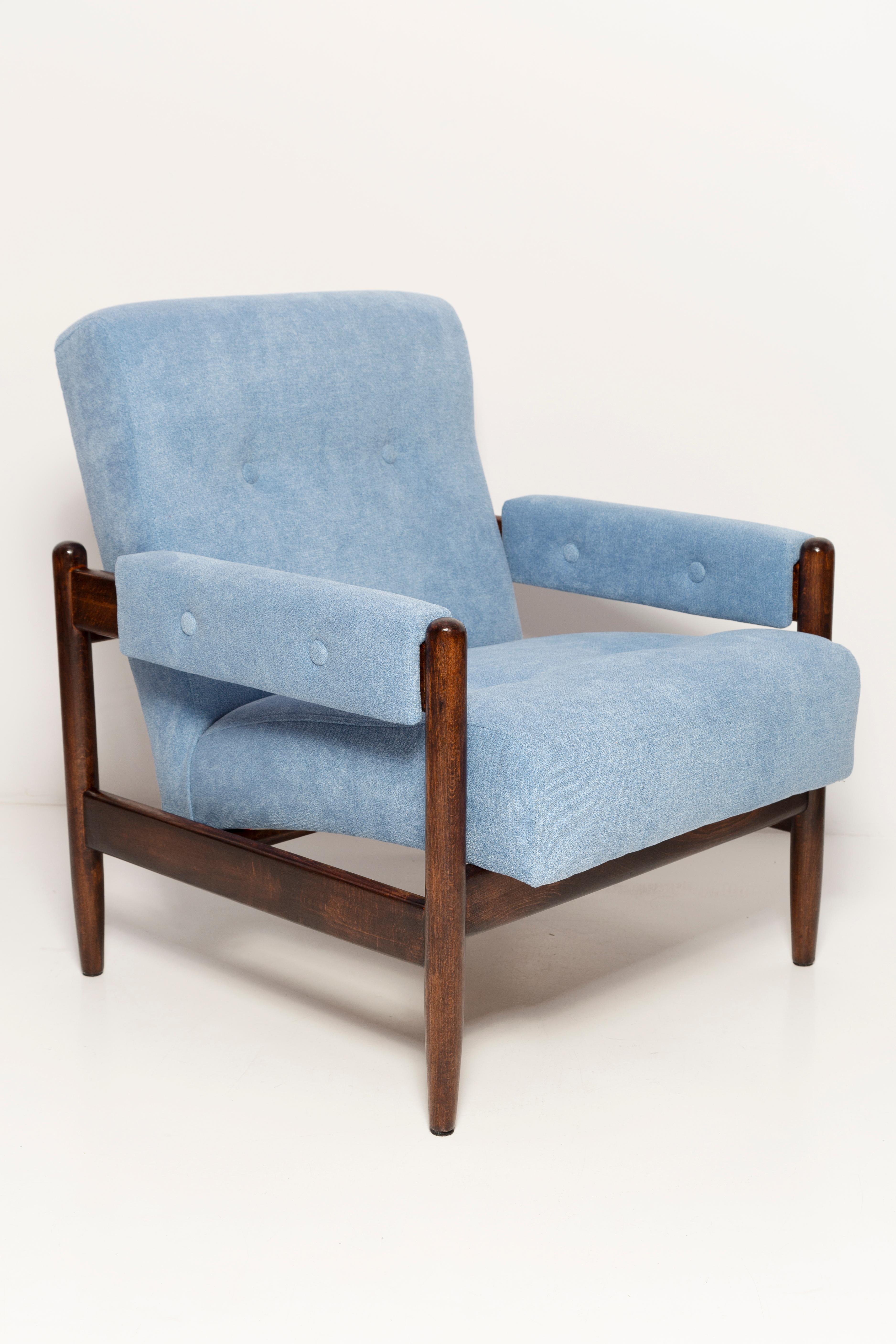 A wonderful armchair made in the 1960s in Poland. Stabile design of the furniture and a comfortable seat. Furniture after full upholstery renovation, refreshed woodwork. The whole is covered with high quality thick, pleasant to the touch fabric. The