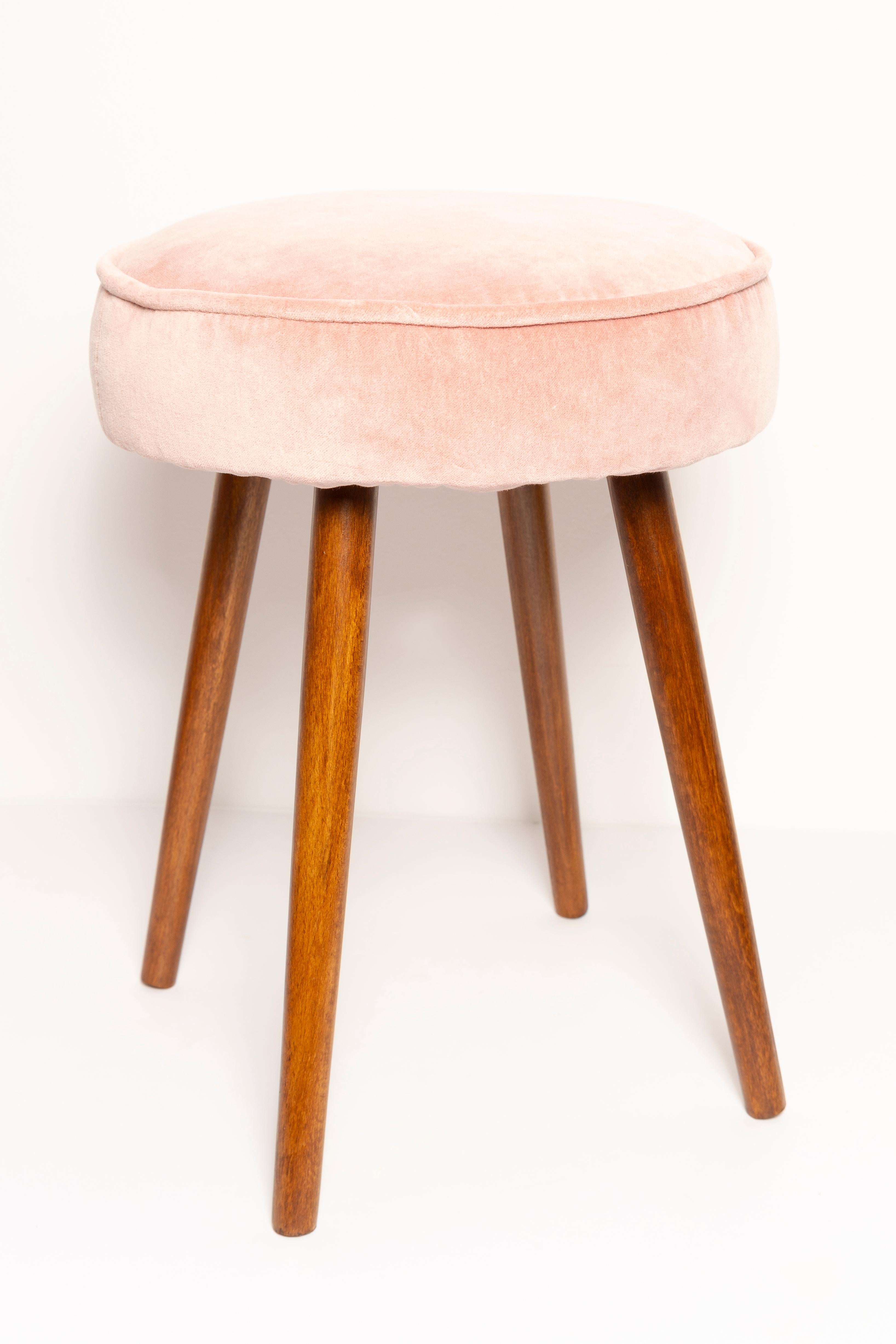 Stool from the turn of the 1960s and 1970s. Beautiful baby pink upholstery. The stool consists of an upholstered part, a seat and wooden legs narrowing downwards, characteristic of the 1960s style. We can prepare this pair also in another color of