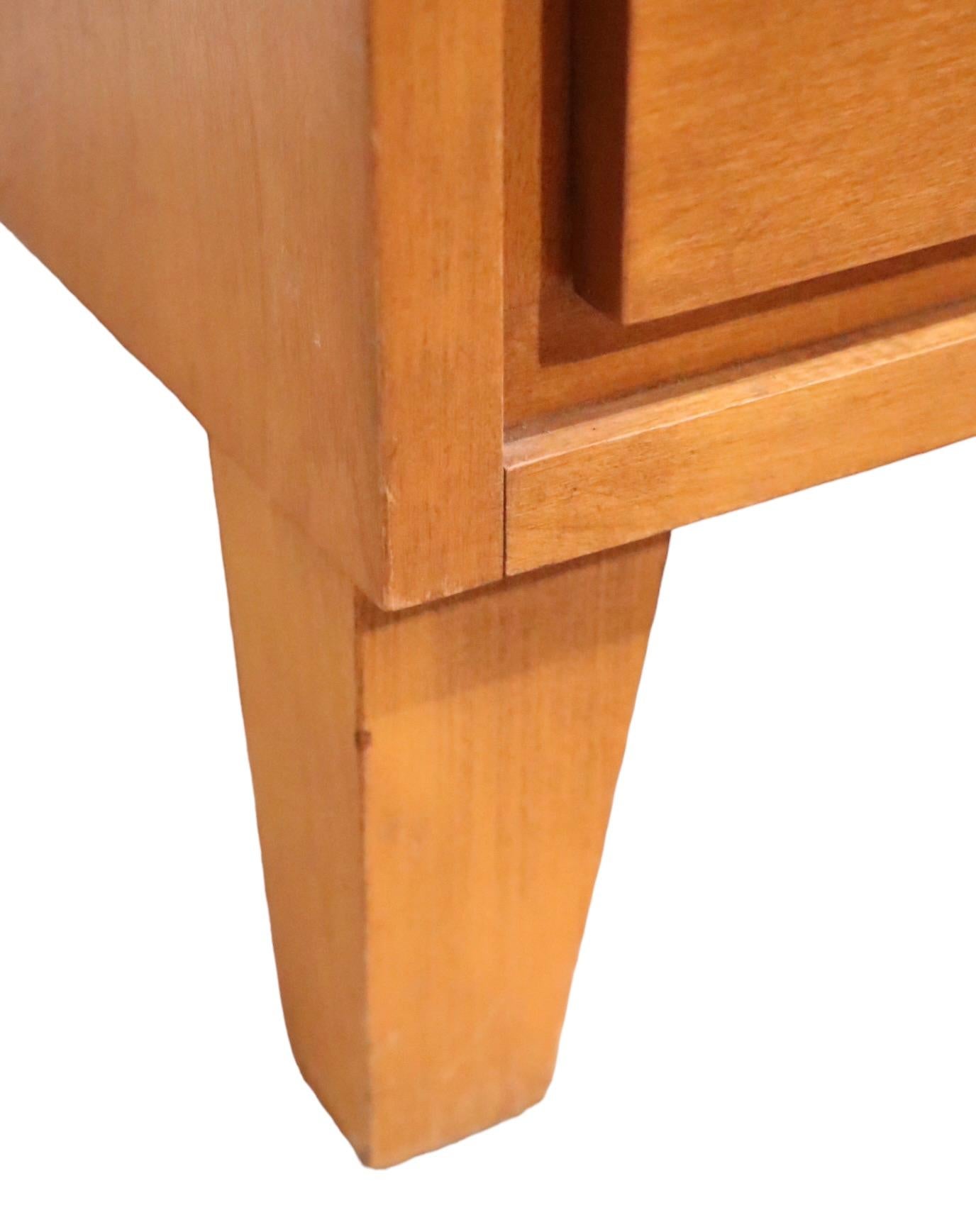   Architectural Mid Century three drawer Bachelors Chest,  designed by Leslie Diamond for Conant Ball,  as part of their hugely successful Modern Mates series, circa 1950's. The piece is  constructed of solid wood, probably birch, and is in