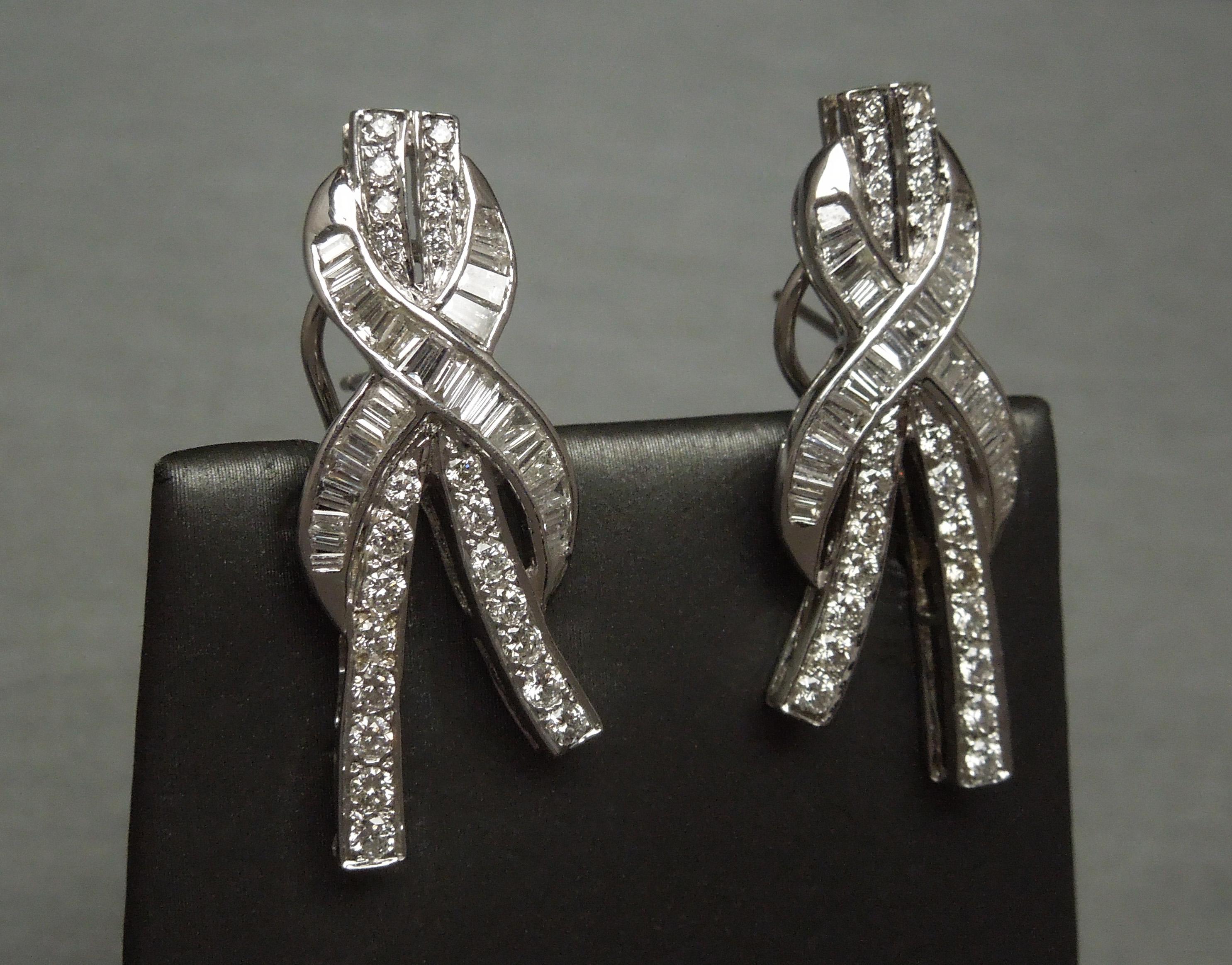 These Mid Century Baguette Ribbon Earrings constructed in 18KT White Gold contain a total of 4.50 carats of Colorless Nearly Flawless Brilliant cuts & Baguettes - all ranking an E-F Color; VVS1-SI2 Clarity [90% are VVS] .. A hand-fabricated matched