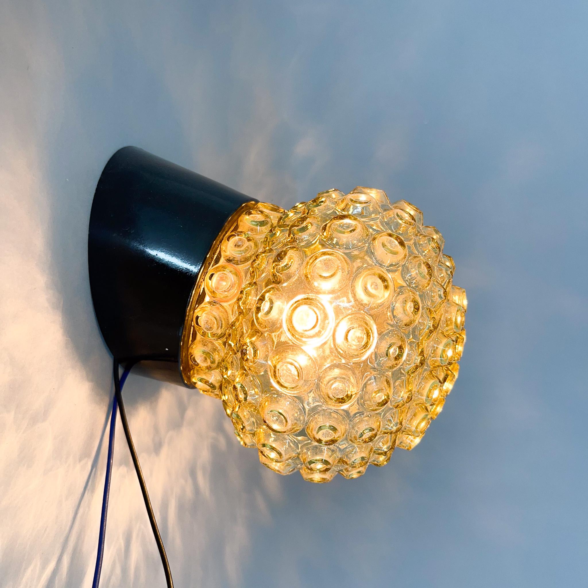 Vintage wall lamp made of bakelite and yellow pressed glass. New wiring. Four items available upon request.